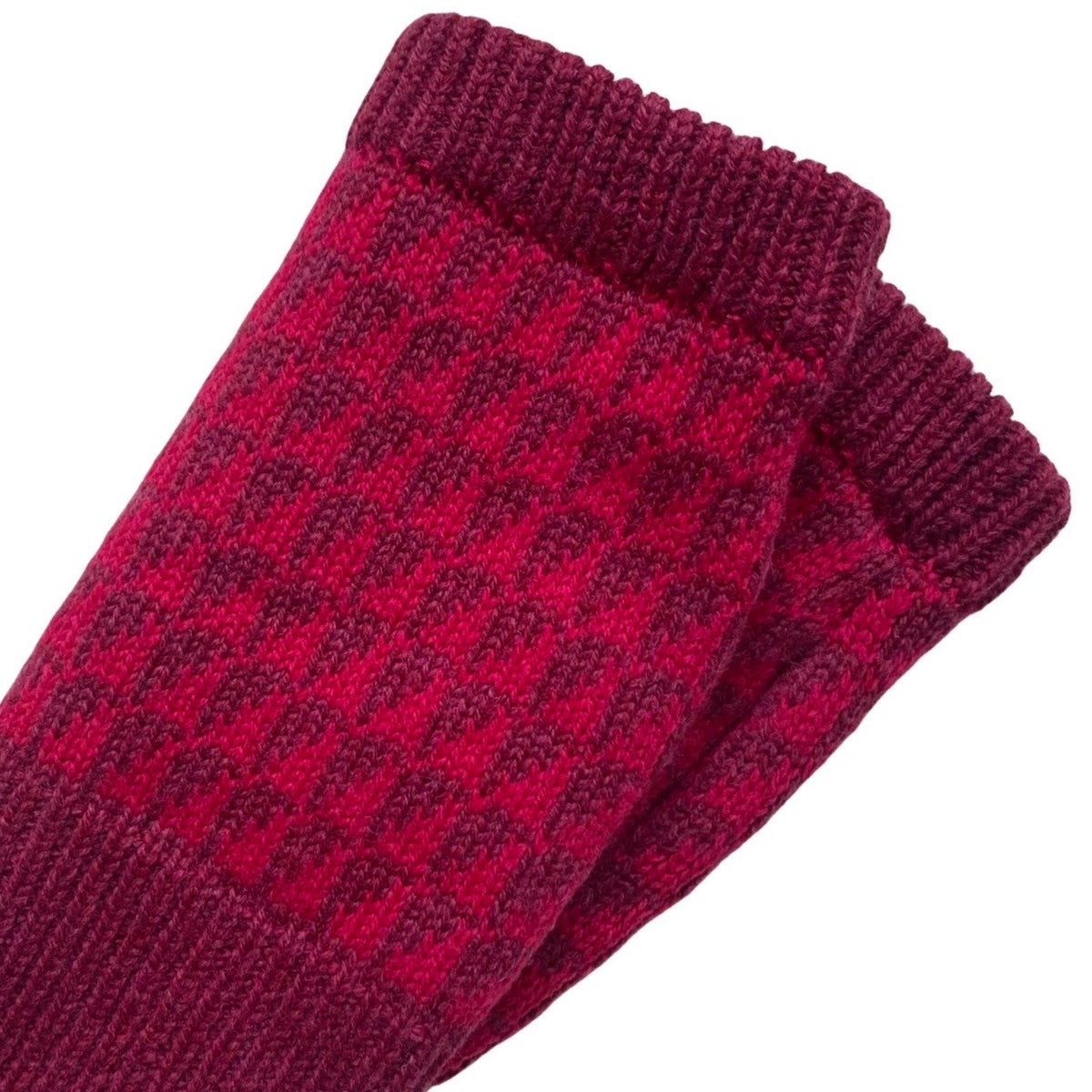 Scarlet and ruby dark pink patterned wrist warmers have a contrasting ruby red cuff and trim.