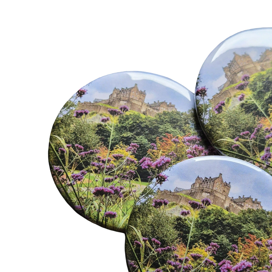 Three circular images of a castle surrounded by greenery and flowers on a white background.