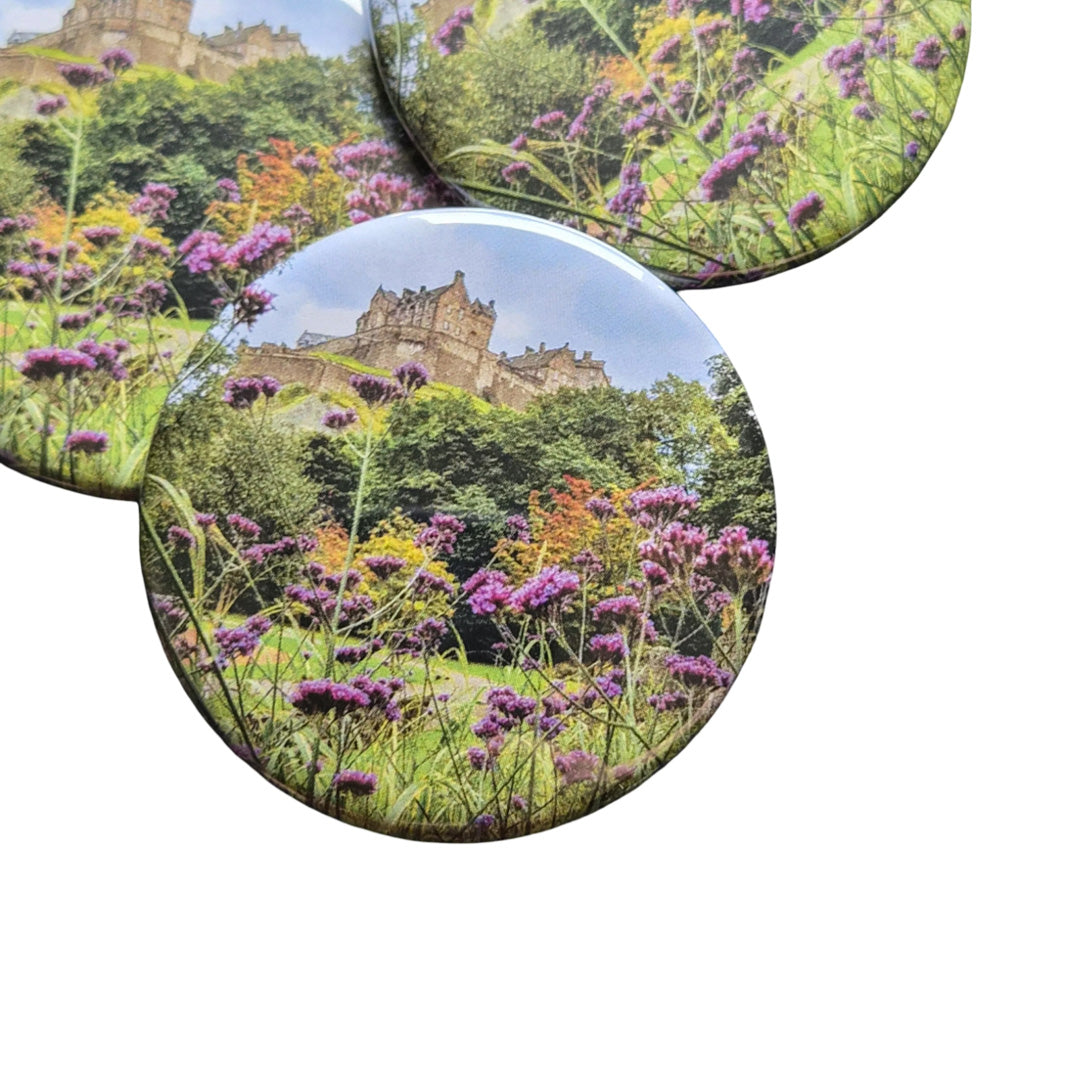 Round magnets with Edinburgh Castle on them.