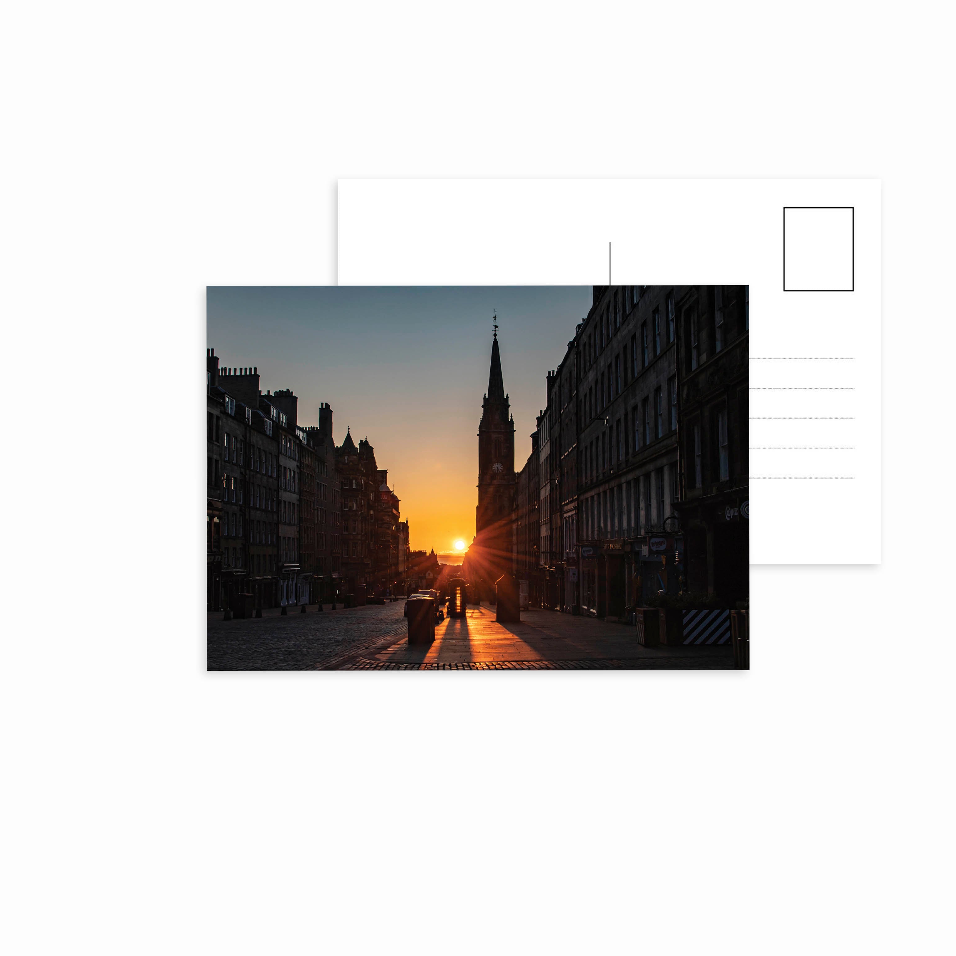 A picture of the sunset on Edinburgh's Royal Mile on a postcard.
