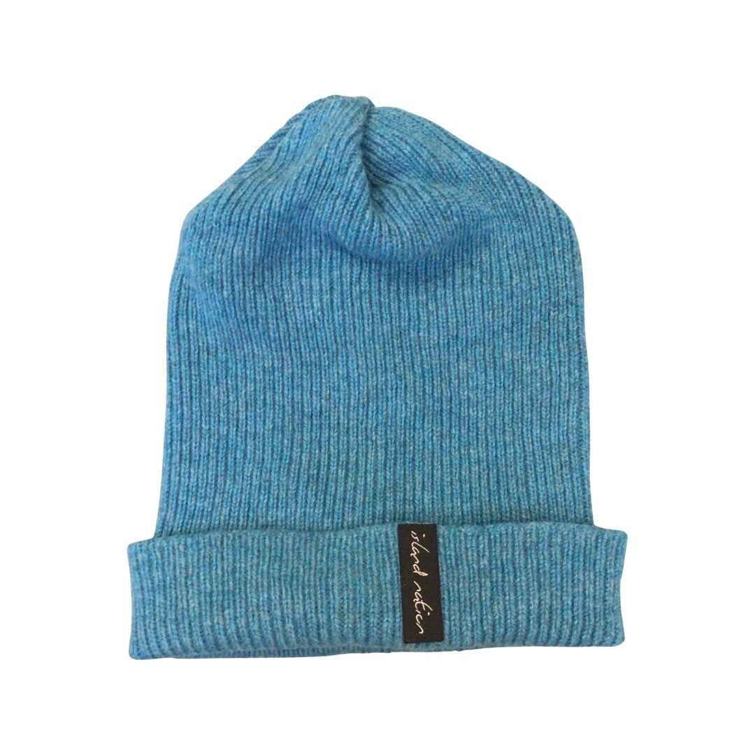 Ribbed teal beanie hat knitted using 100% teal British lambswool.