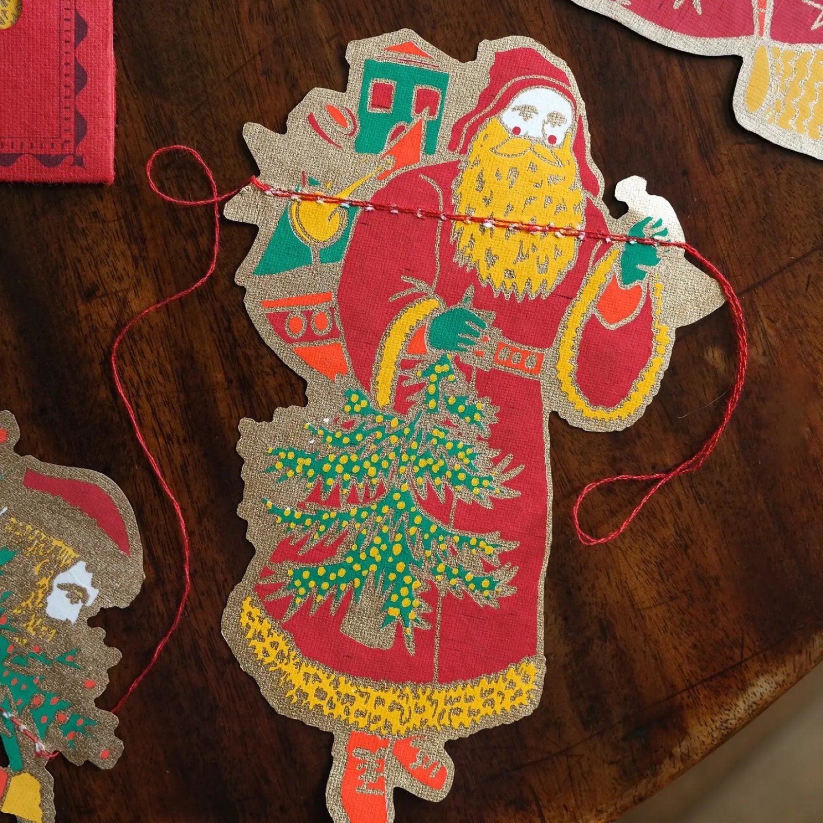 A screen printed Santa Clause from a Saint Nicholas paper garland.