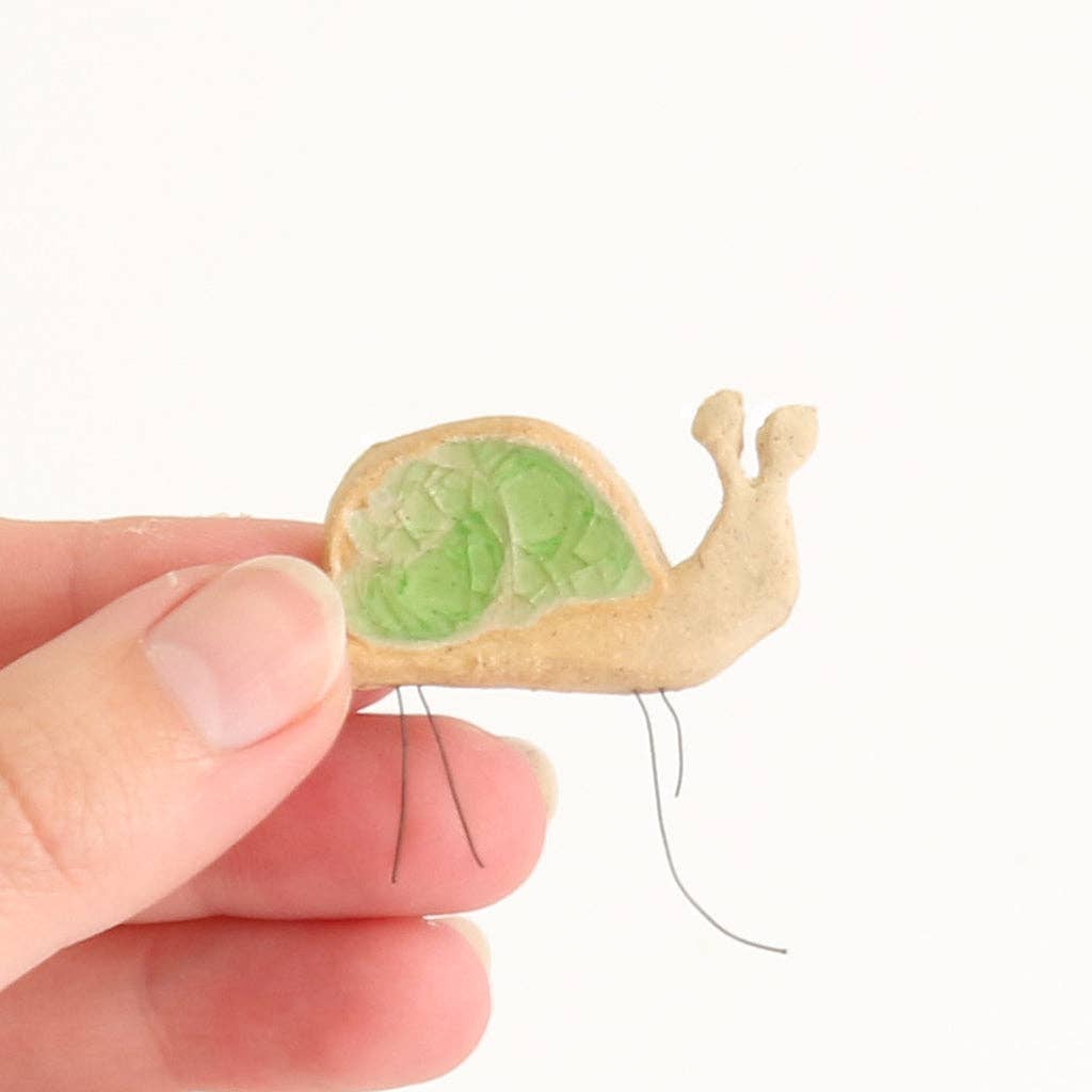Snail plant hugger, handmade using British clay and recycled glass.
