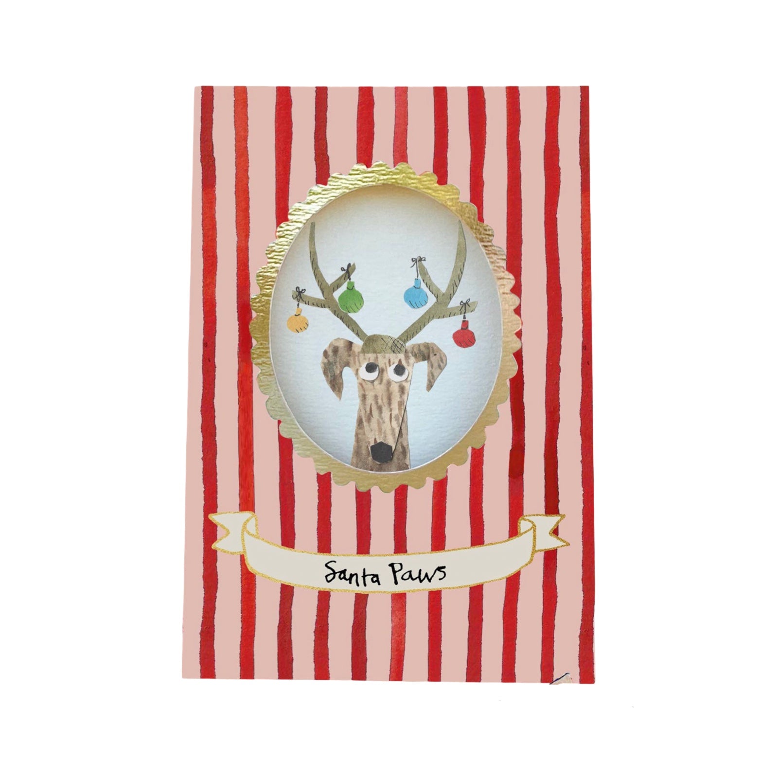 A Christmas greeting card featuring a red and pink striped background with a central gold-bordered oval illustration of a dog, holding colourful ornaments on its hat with antlers. A cream banner at the bottom reads 'Santa Paws'.
