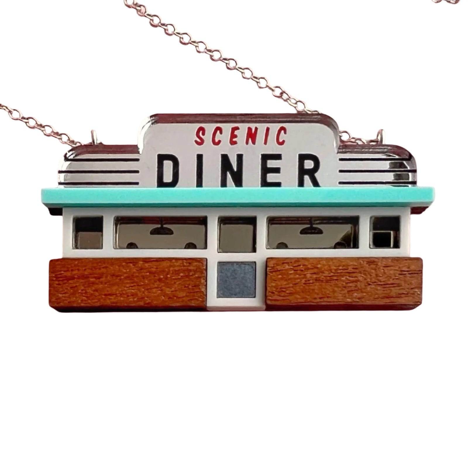 This necklace features a retro-inspired American diner as a pendant.