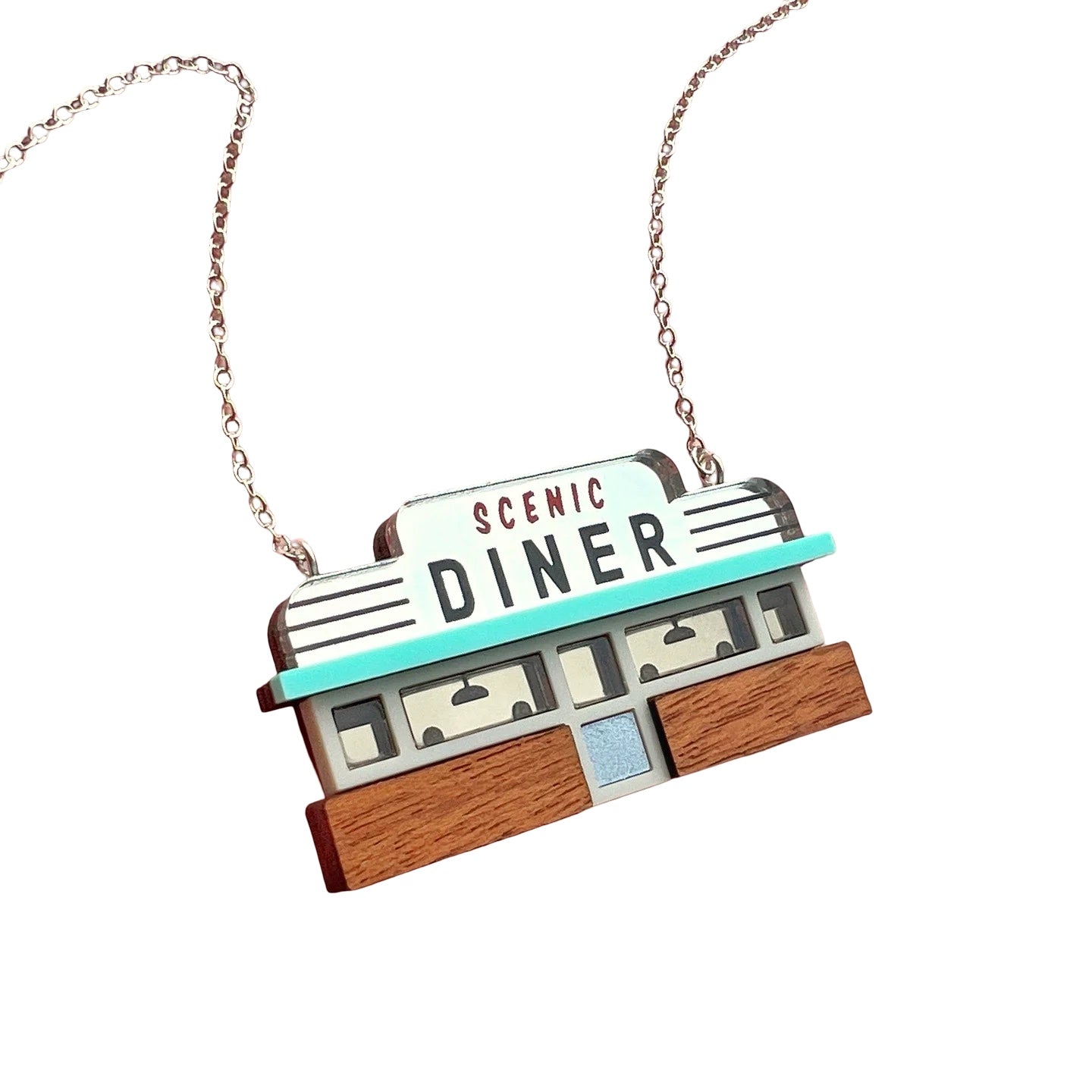 This necklace features a retro-inspired American diner as a pendant.