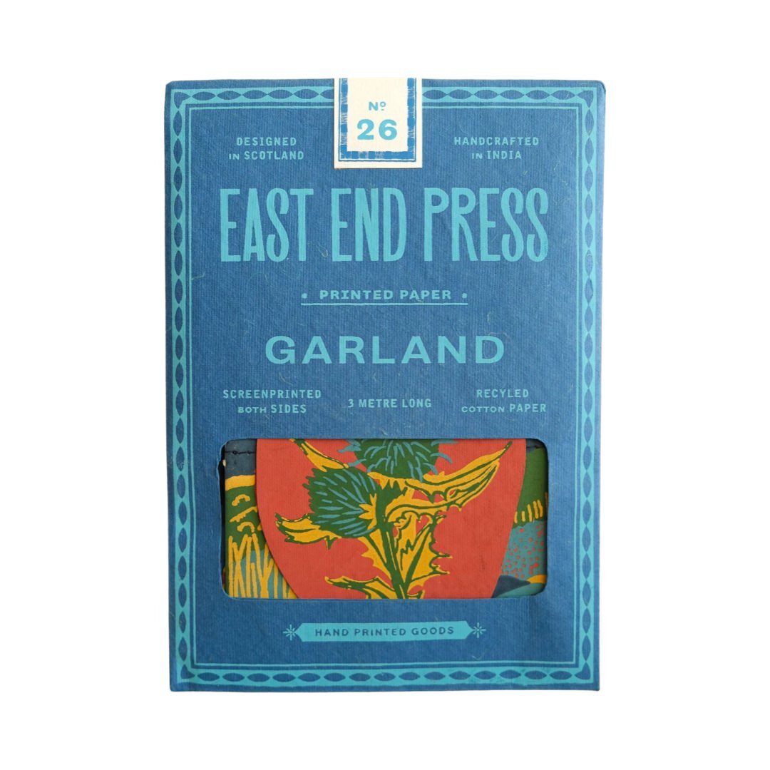 A blue rectangular paper packet for a Scotland paper garland.