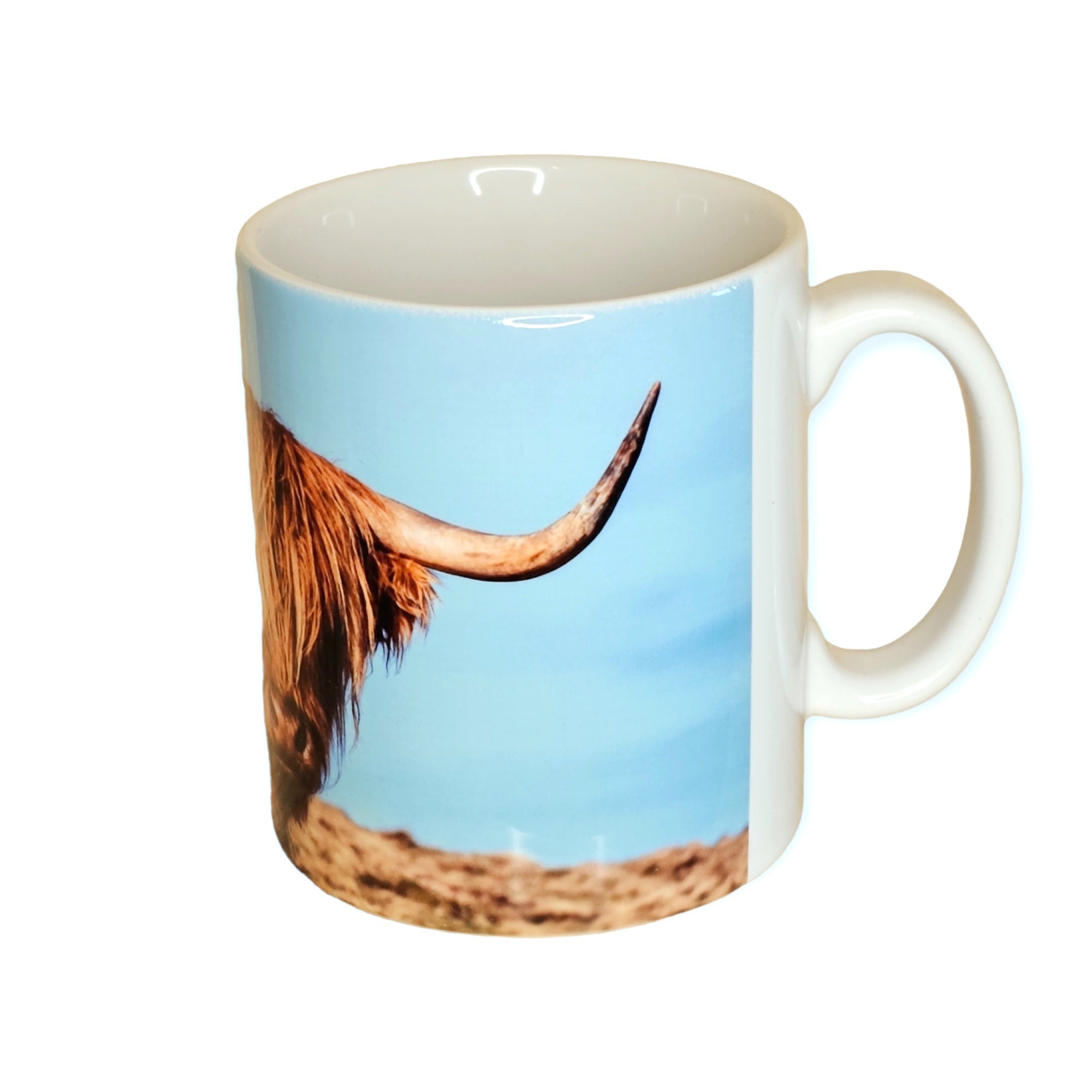 A mug featuring a Highland Cow.