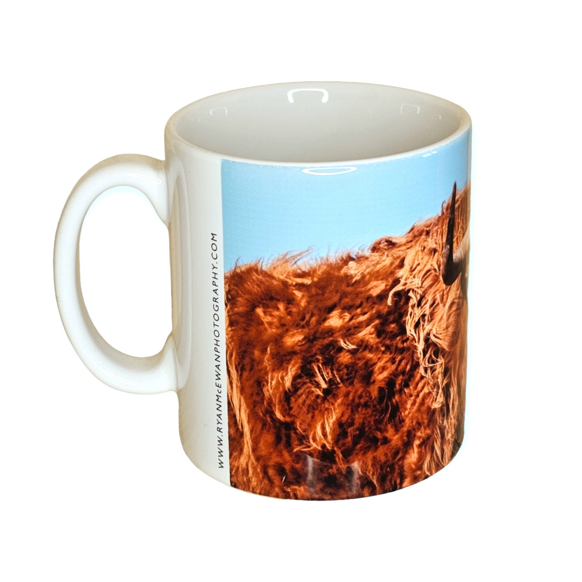A mug featuring a Highland Cow.