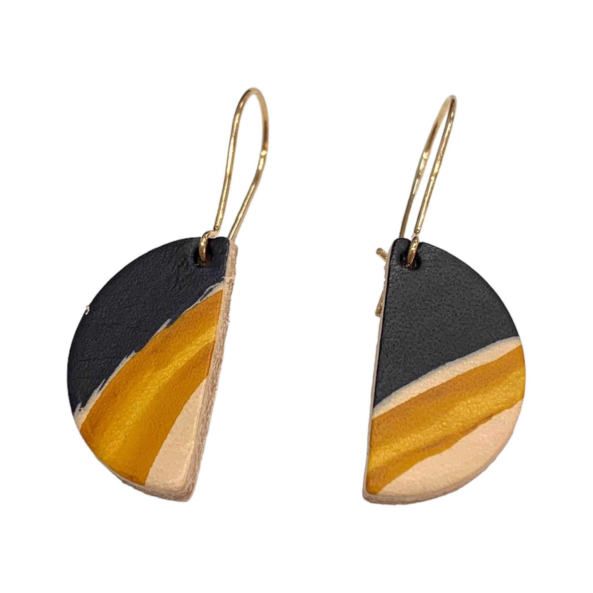 These semi circle drop earrings are crafted with hand-painted lightweight leather.