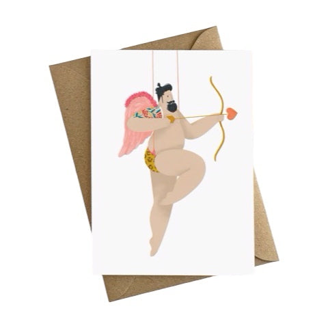 Card featuring an illustration of a sexy, bearded, tattooed man in his leopard print swim trunks and cupid wings firing a bow with a love heart on the end.