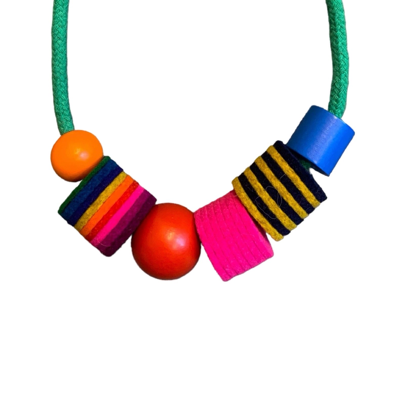 Handmade chunky industrial felt beads contrast with painted wooden beads.