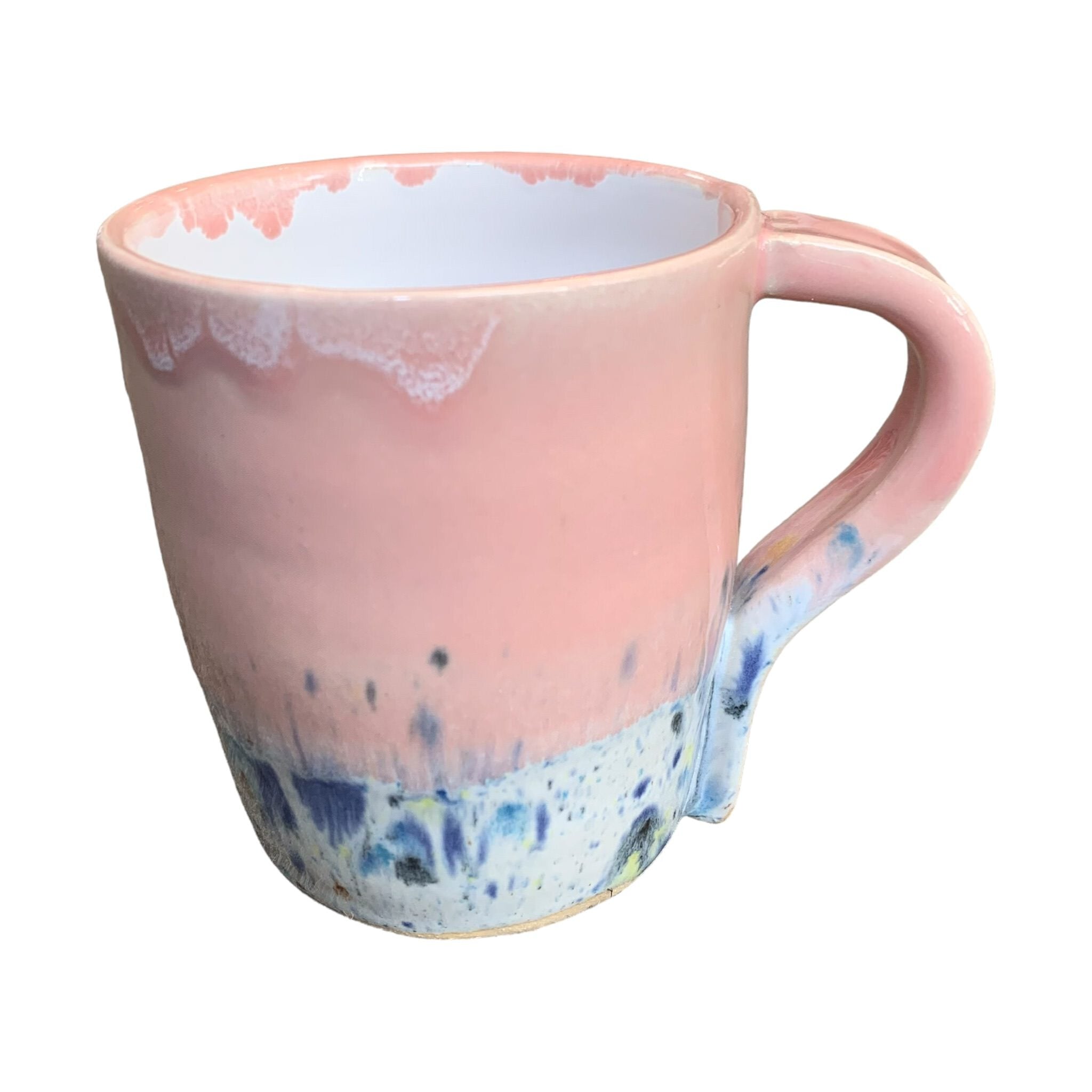A pink mug with a shoreline pattern around the bottom half.
