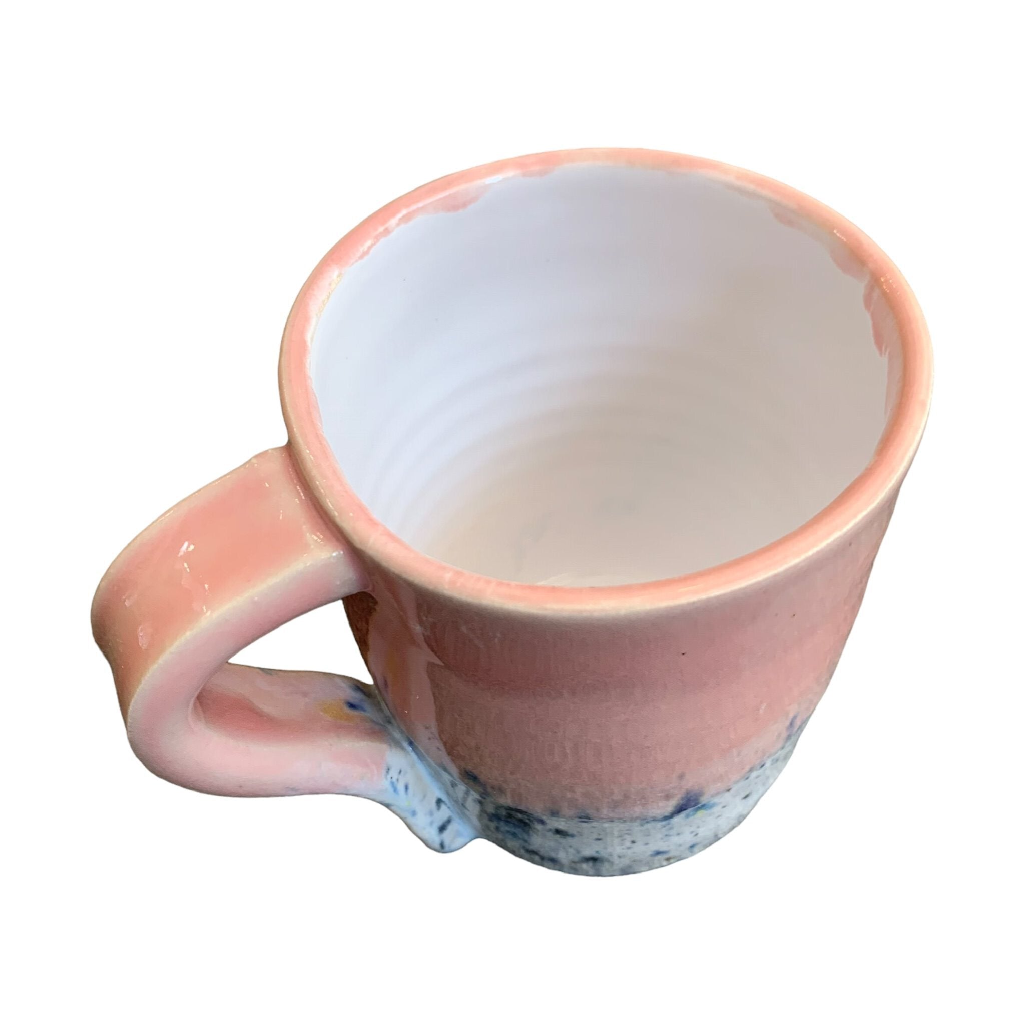 The top of a pink shoreline mug.