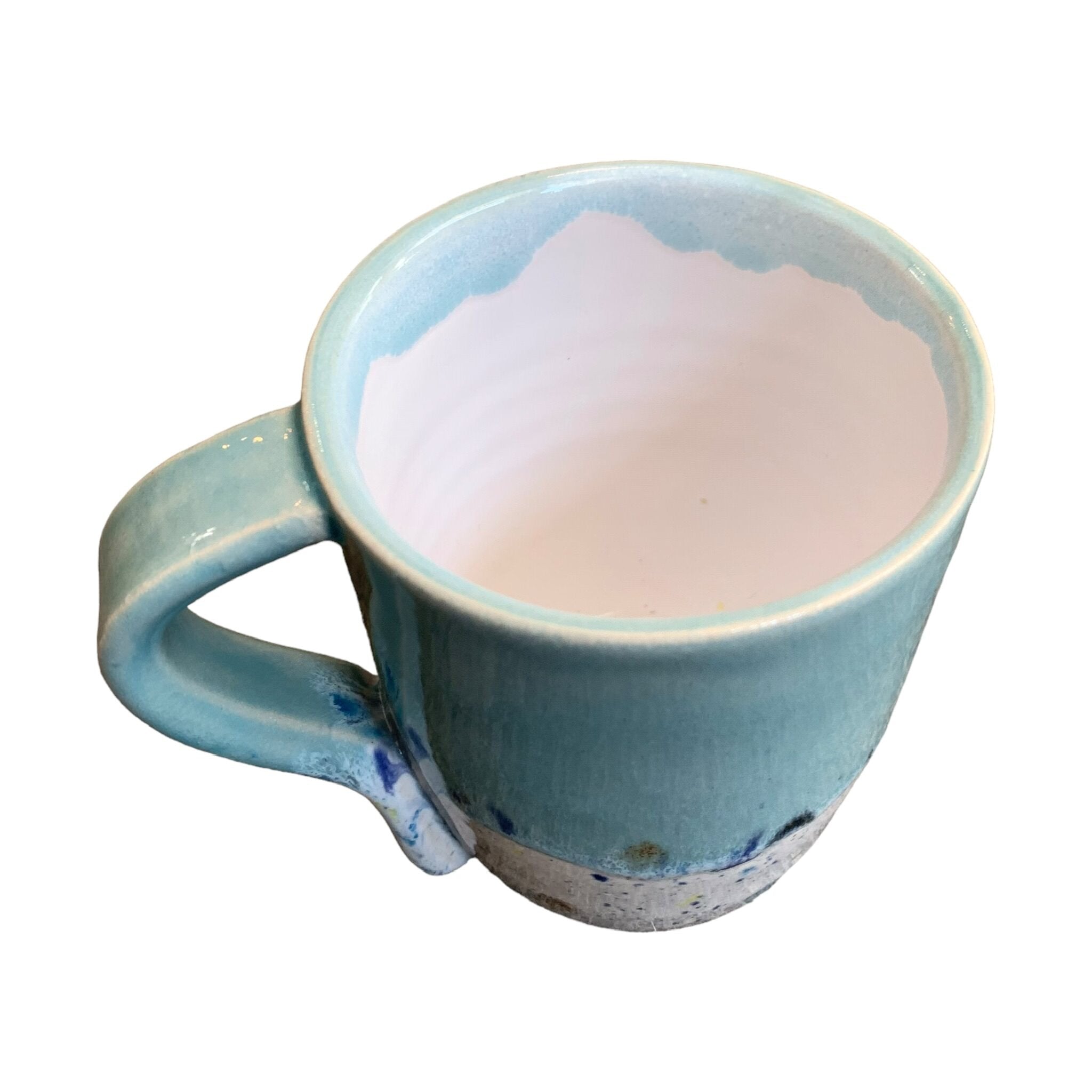 The top of a turquoise shoreline mug.