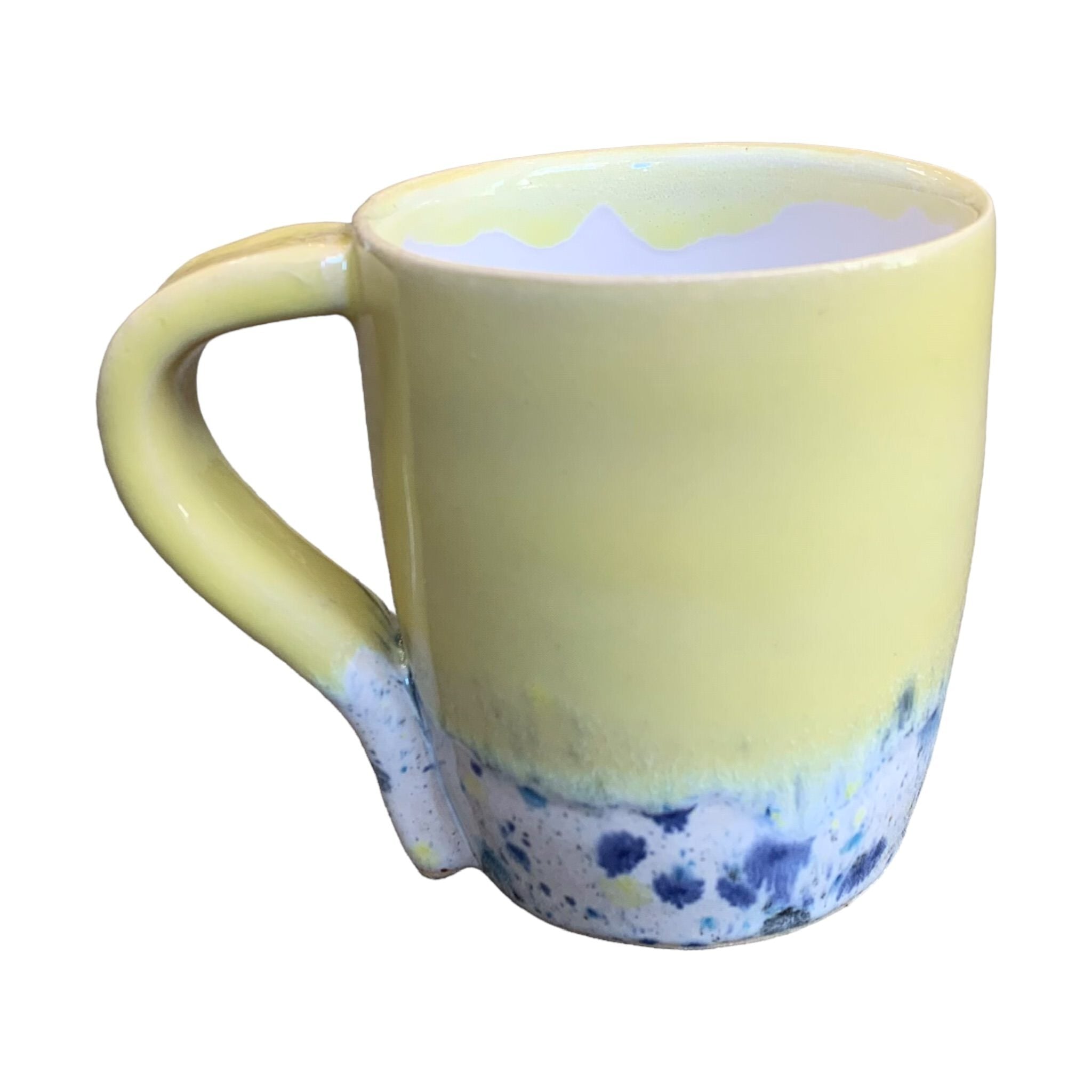 A yellow mug with a shoreline pattern around the bottom half.