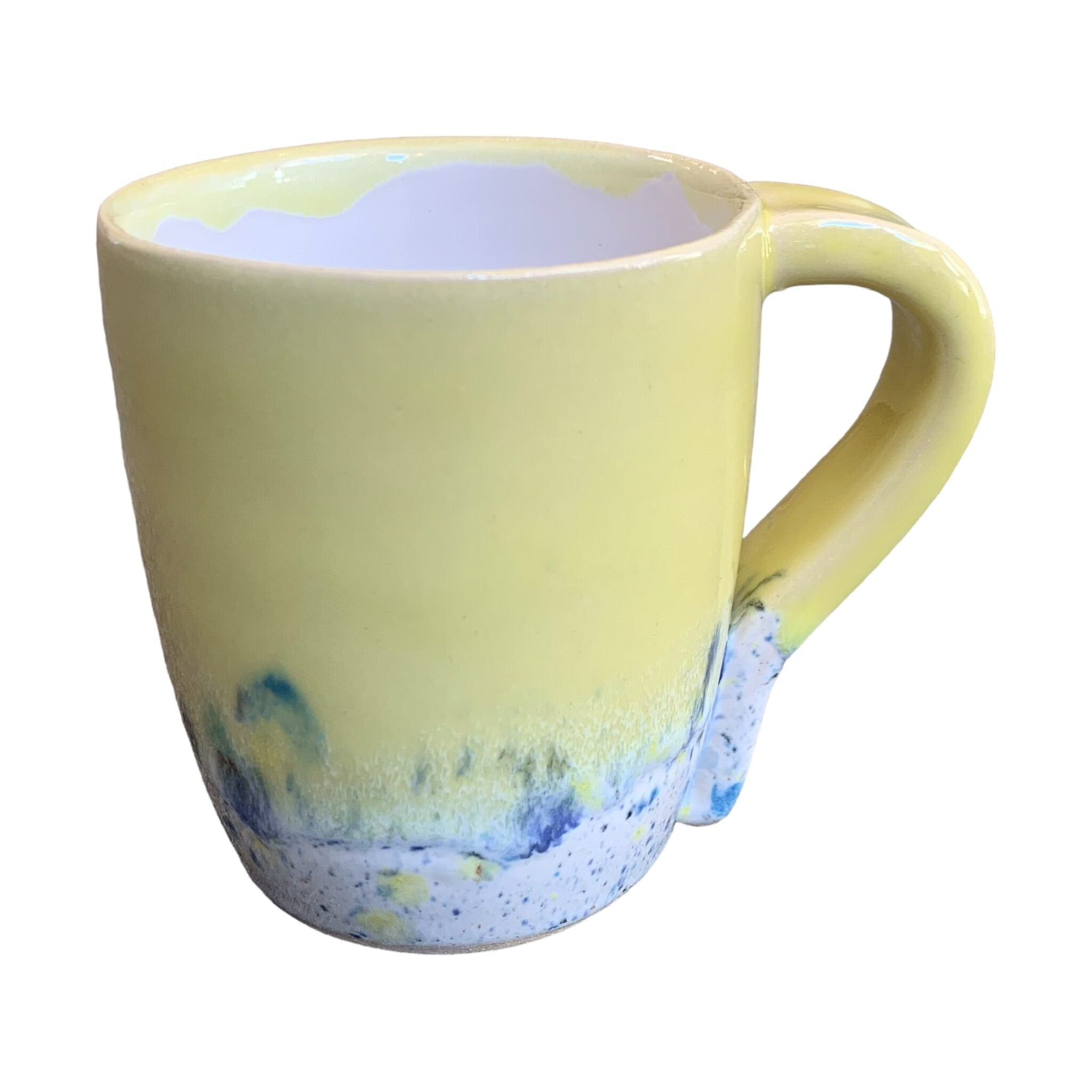 A yellow mug with a shoreline pattern around the bottom half.