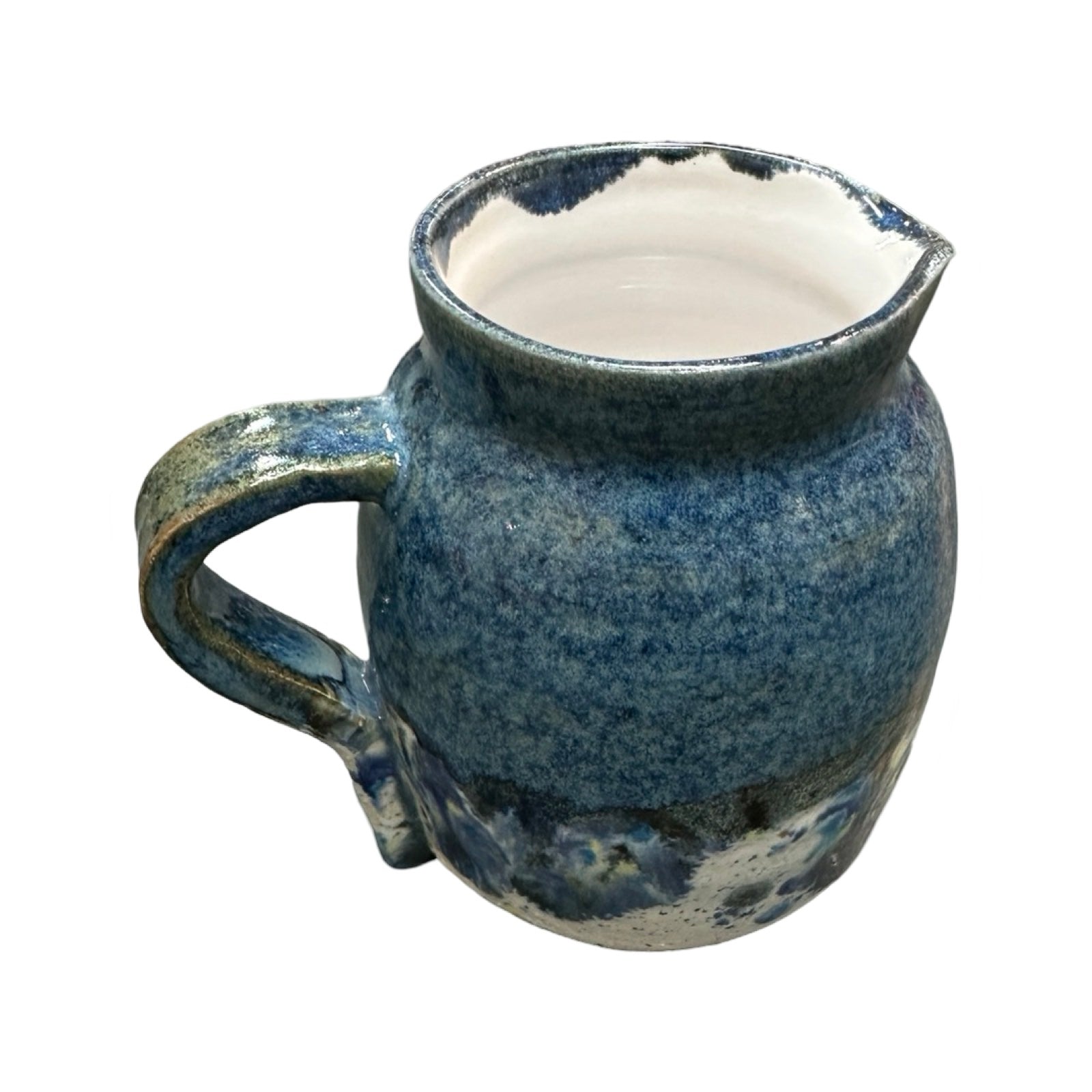 Handmade pottery jug in navy blue and white with a colour splash design.