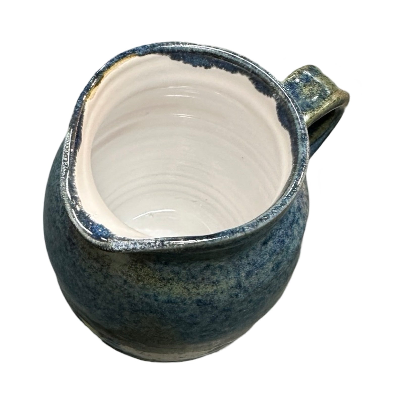 Handmade pottery jug in navy blue and white with a colour splash design.