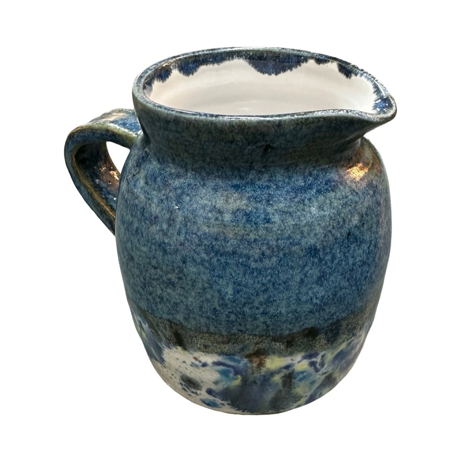 Handmade pottery jug in navy blue and white with a colour splash design.