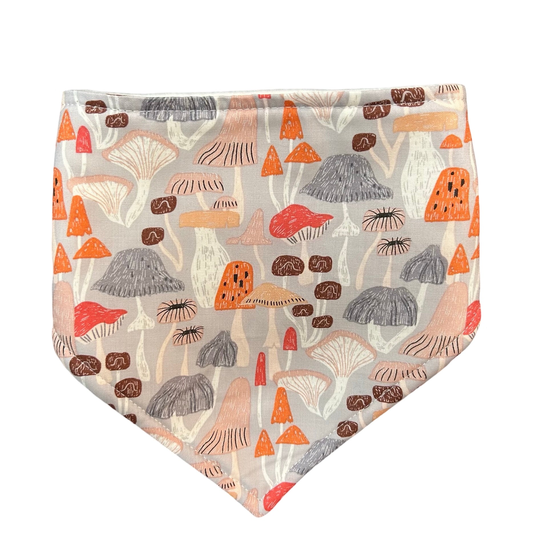 Triangular shaped baby bandana style bib in colourful mushroom fabric.