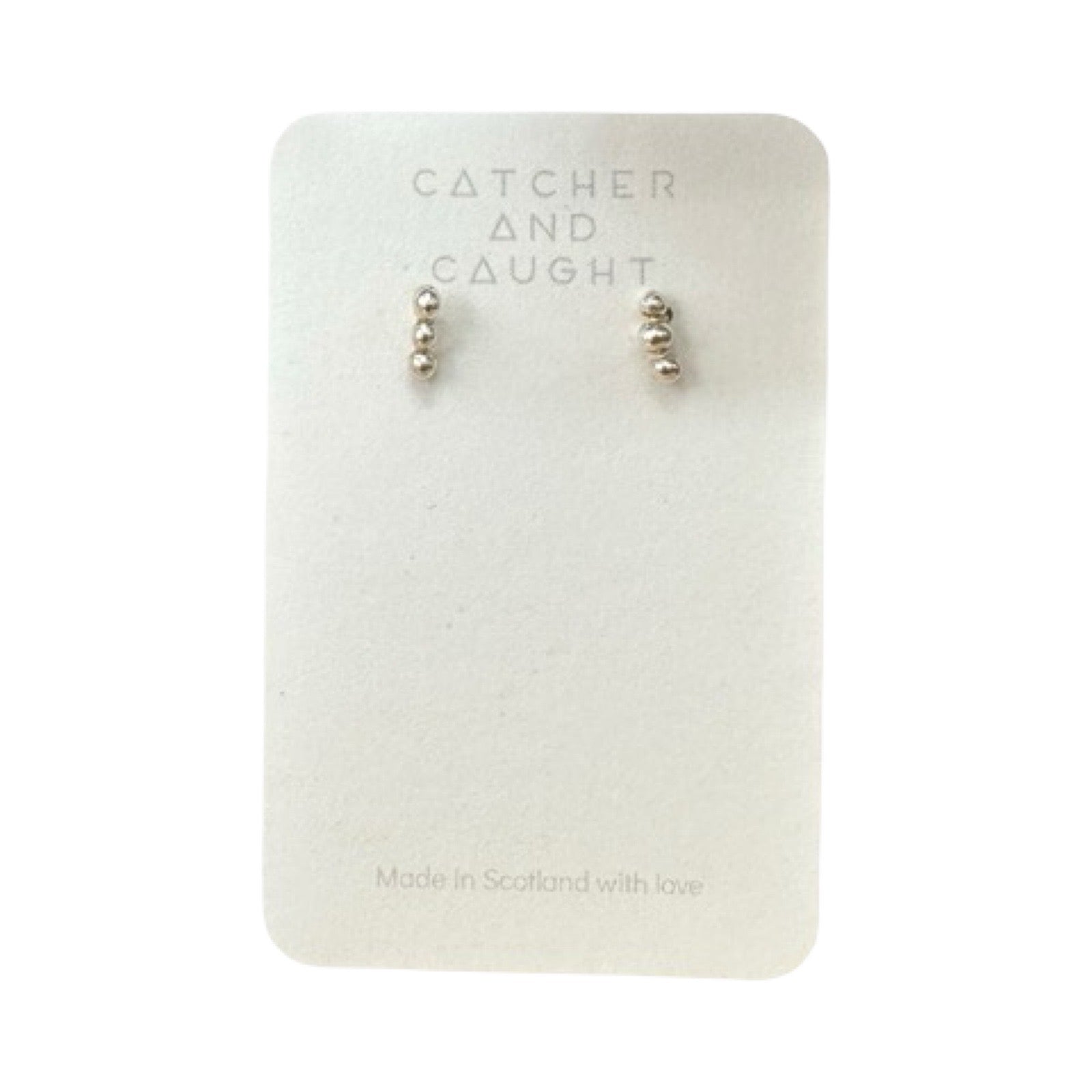 Silver bubble earrings packaged.
