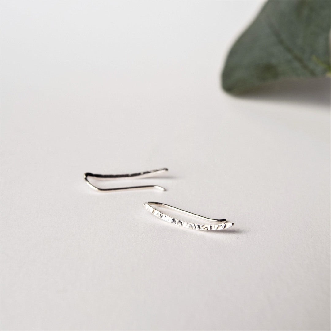 Elegant ear climbers with a subtle curve to follow the shape of your ear. Pinch to secure in place.
