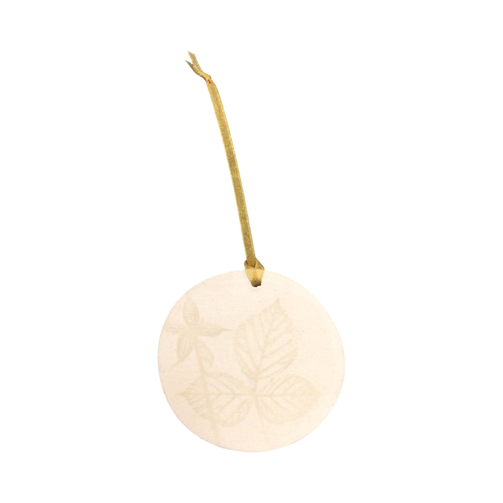 Round beige ornament with a string on a white background