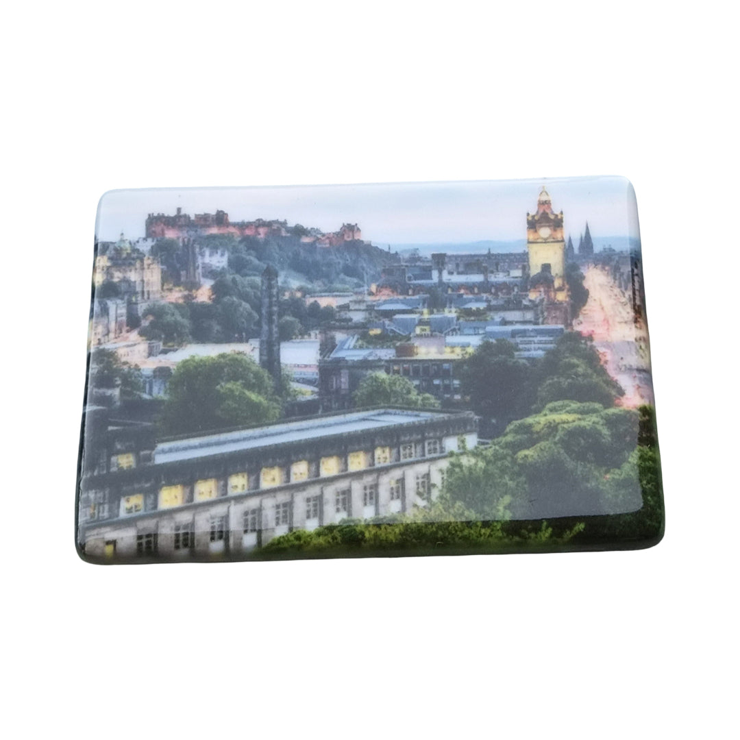 A ceramic tile coaster with an image of Edinburgh Castle on it.