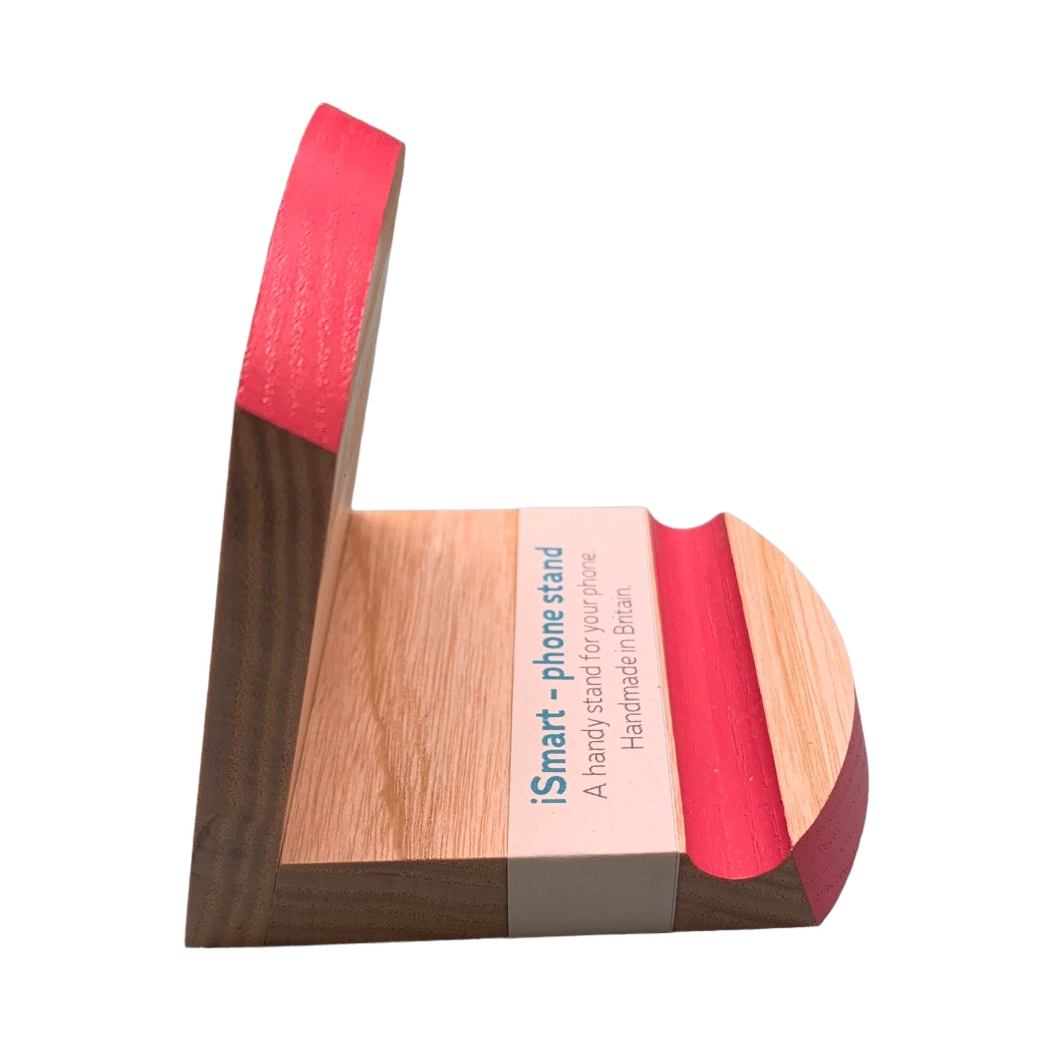 Wooden smart phone stand with a pink top edge and groove.