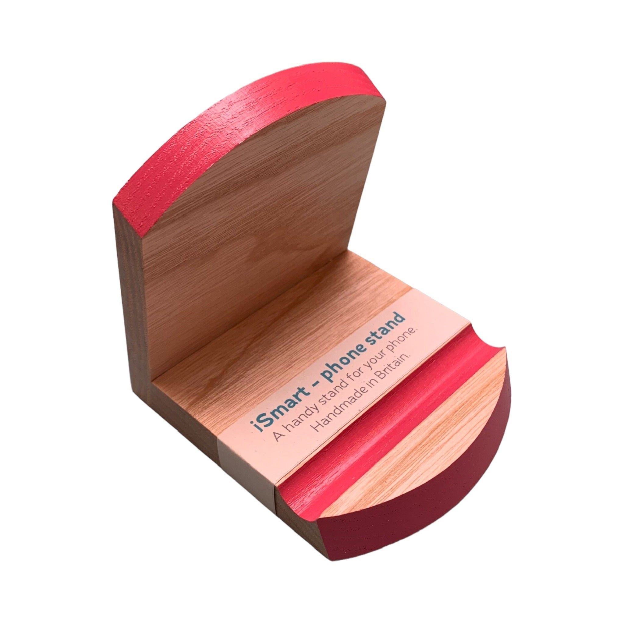 Wooden smart phone stand with a pink top edge and groove.