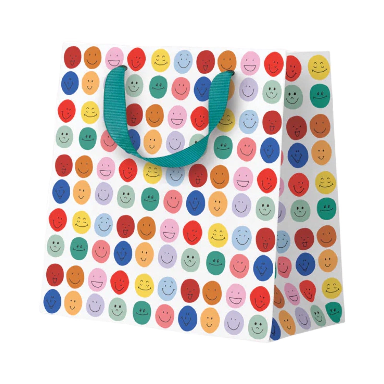 A white gift bag decorated with a colorful pattern of smiling face circles in various colours, featuring teal ribbon handles.