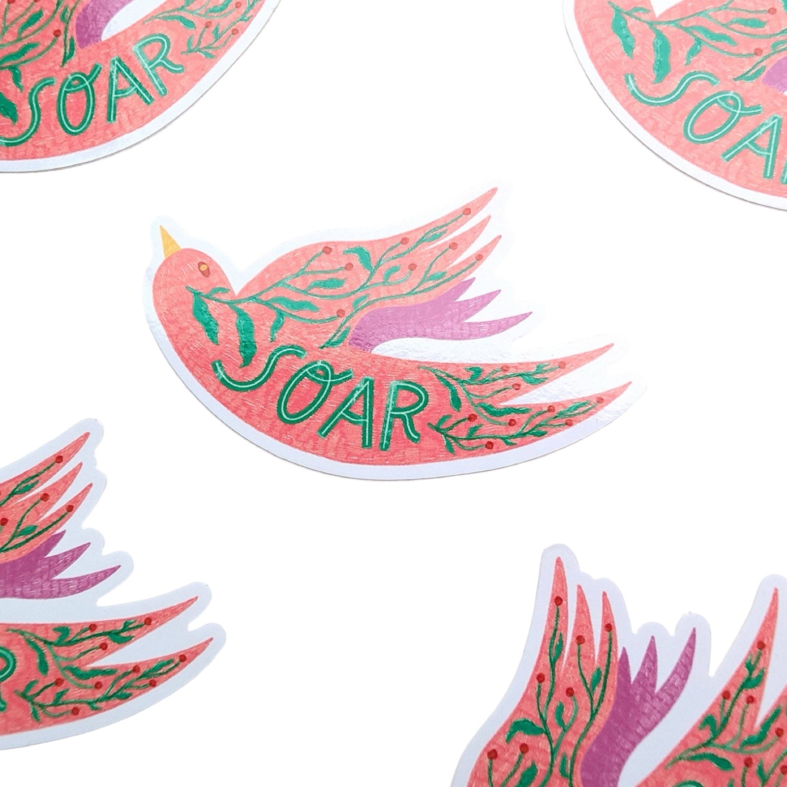 Stickers with a pink and green dove design and 'SOAR' text on a white background.