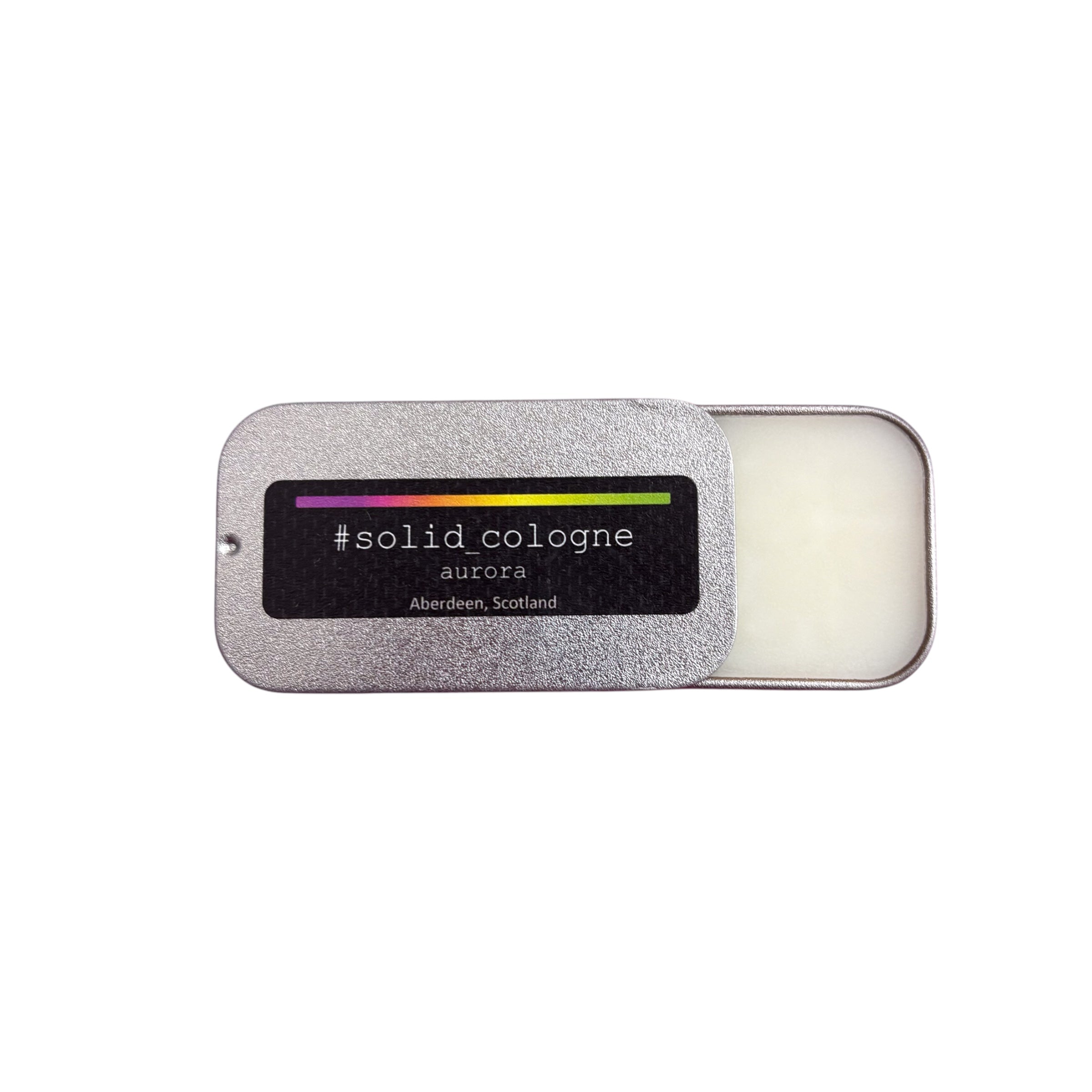 A small silver tin of 'aurora' scented solid cologne, half open.
