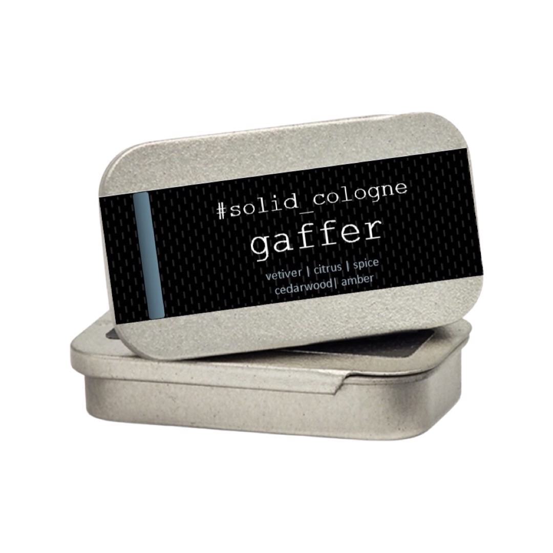 A small silver tin of 'gaffer' scented solid cologne.