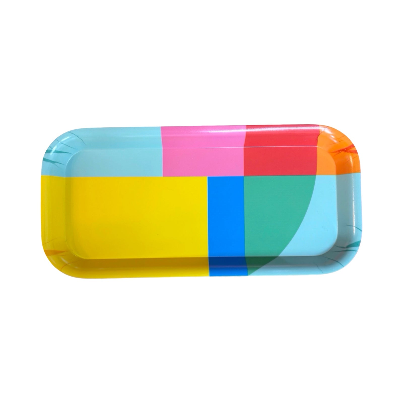 A rainbow geometric rectangular tray with main colours of yellow, aqua and pink.