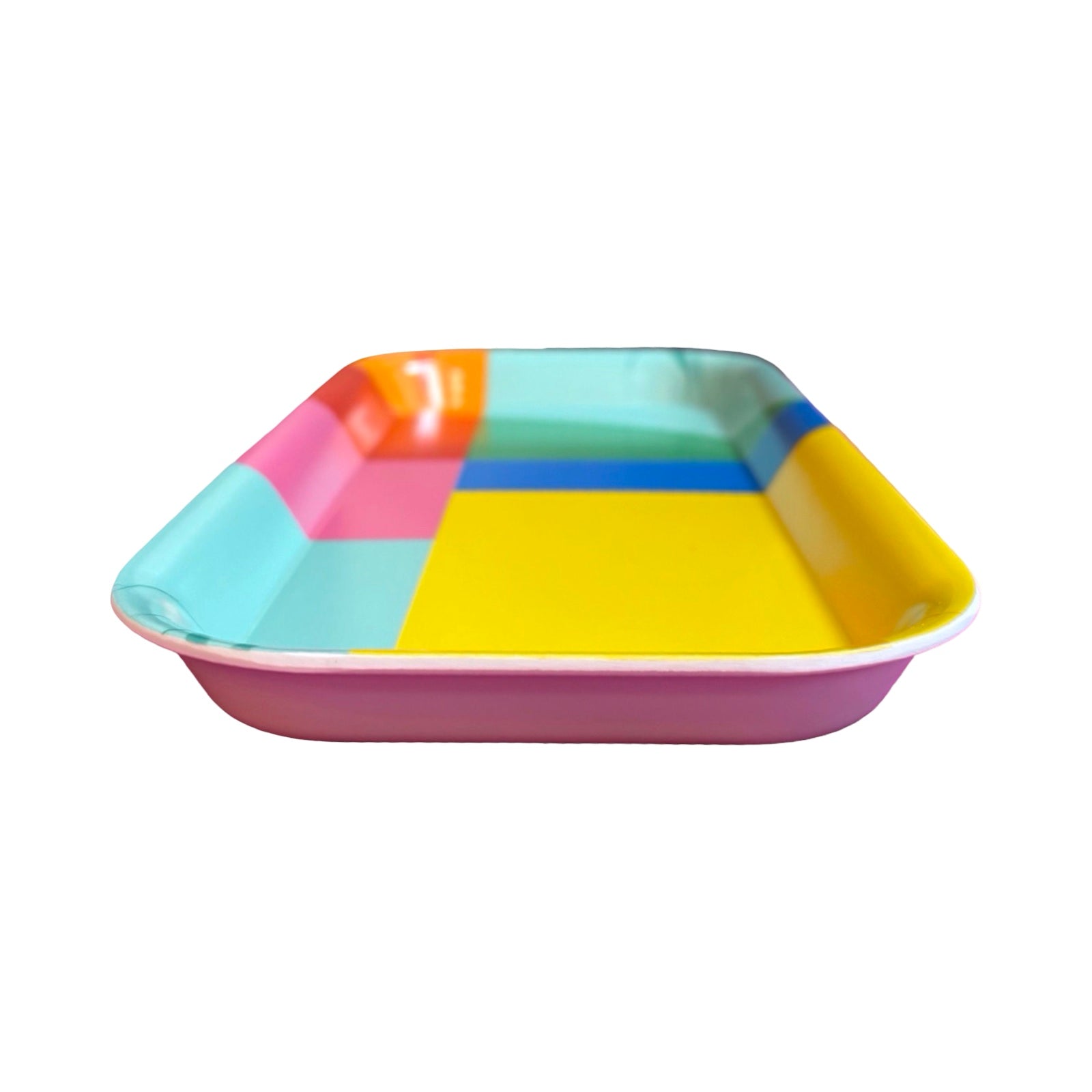 The side of a rainbow geometric rectangular tray with main colours of yellow, aqua and pink.