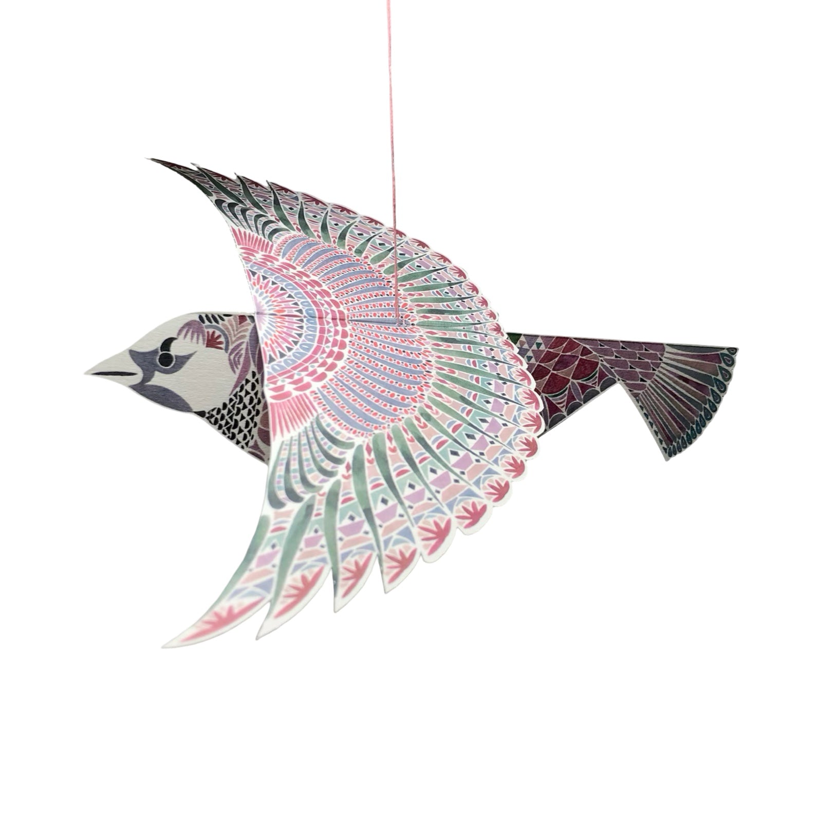 Decorative bird-shaped ornament with intricate patterns on a white background.