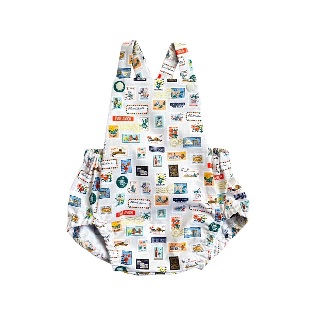 A short romper with a stone stamp fabric featuring stamps.