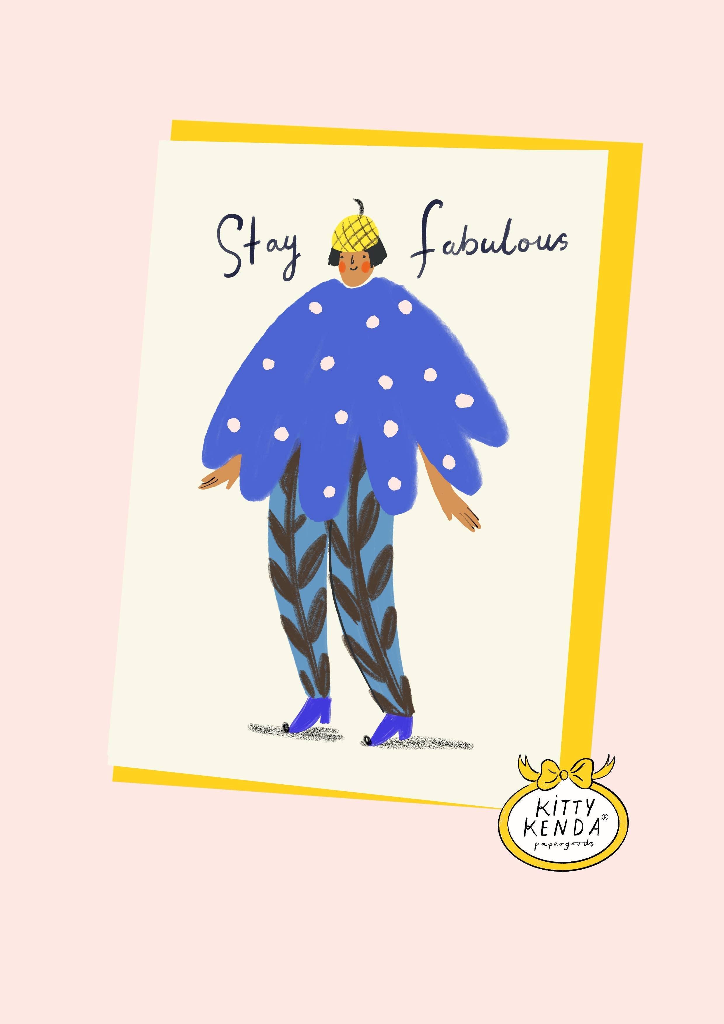 A stylised illustrated greeting card on a pale pink background. The card shows a person wearing a bright blue polka-dot top and patterned pants with the words 'Stay Fabulous' above them.