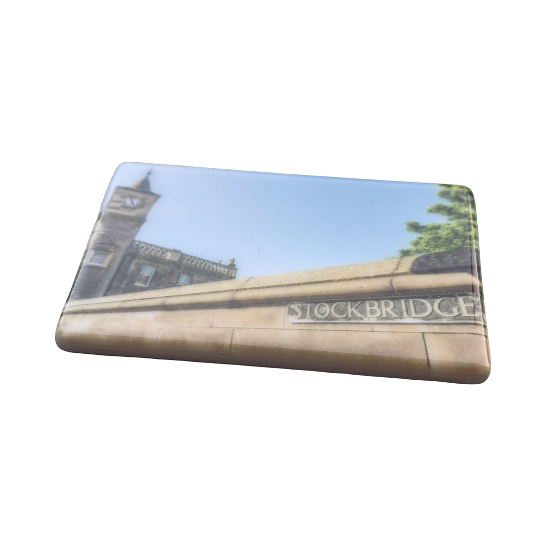 A ceramic magnet with an image of Stockbridge on it.