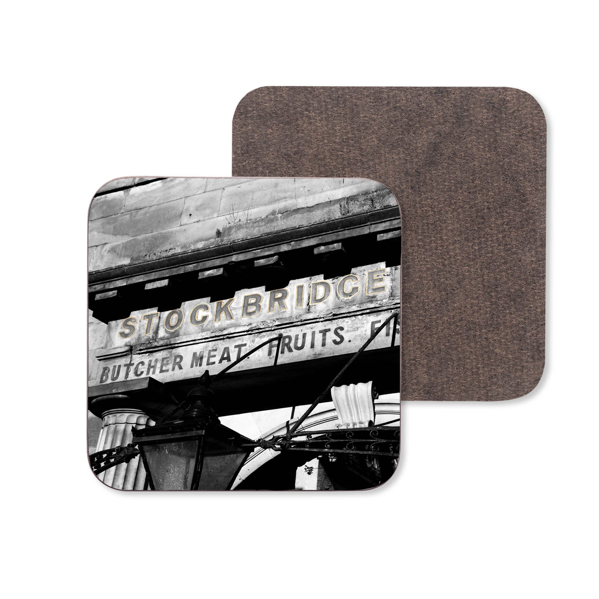 A close up of the Stockbridge Market Edinburgh sign on a ceramic coaster.