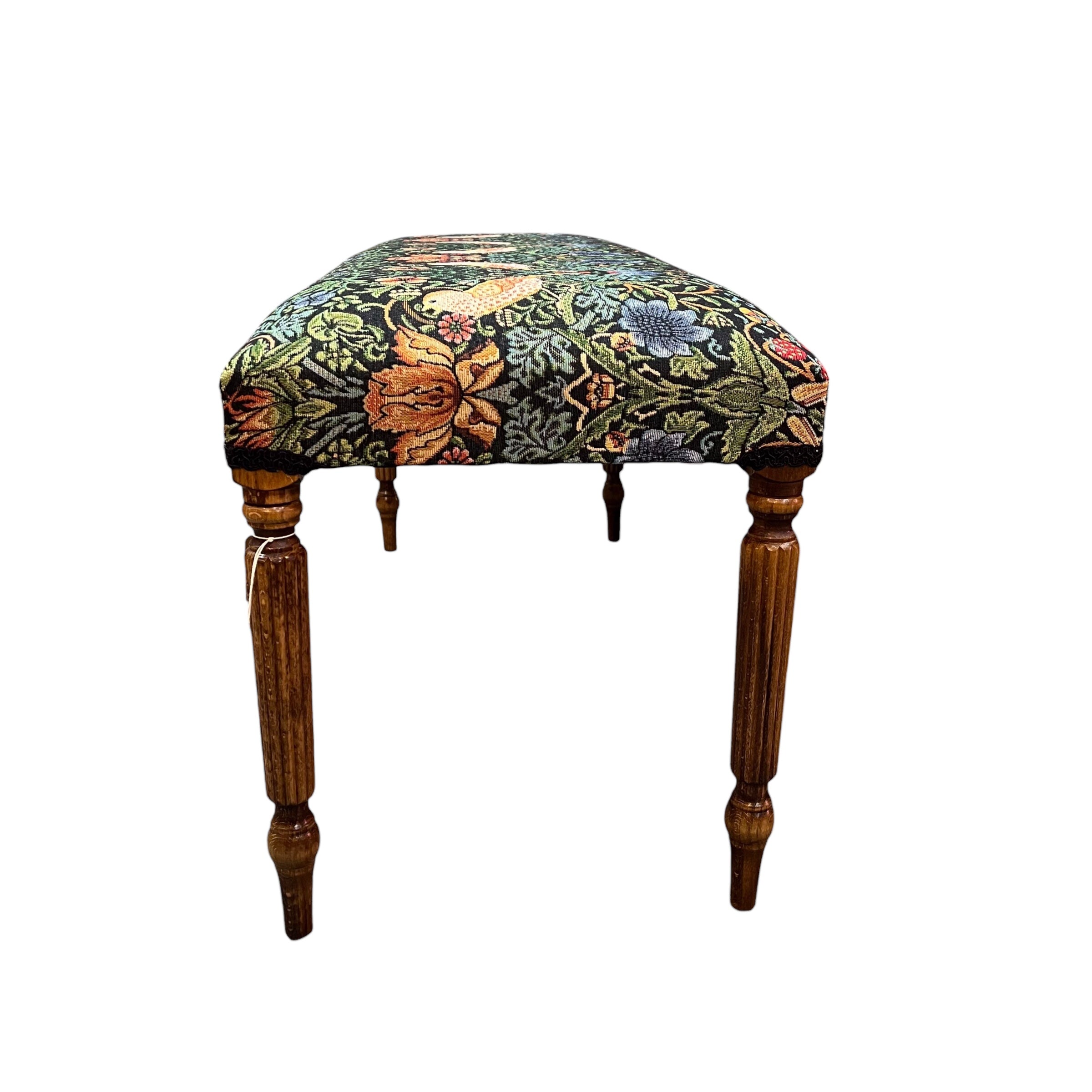 A beautiful hand crafted occasional bench, perfect for any lounge, conservatory or bedroom. Covered in a beautiful Strawberry Thief cotton in darker tones embroidery style fabric with mahogany stained legs.