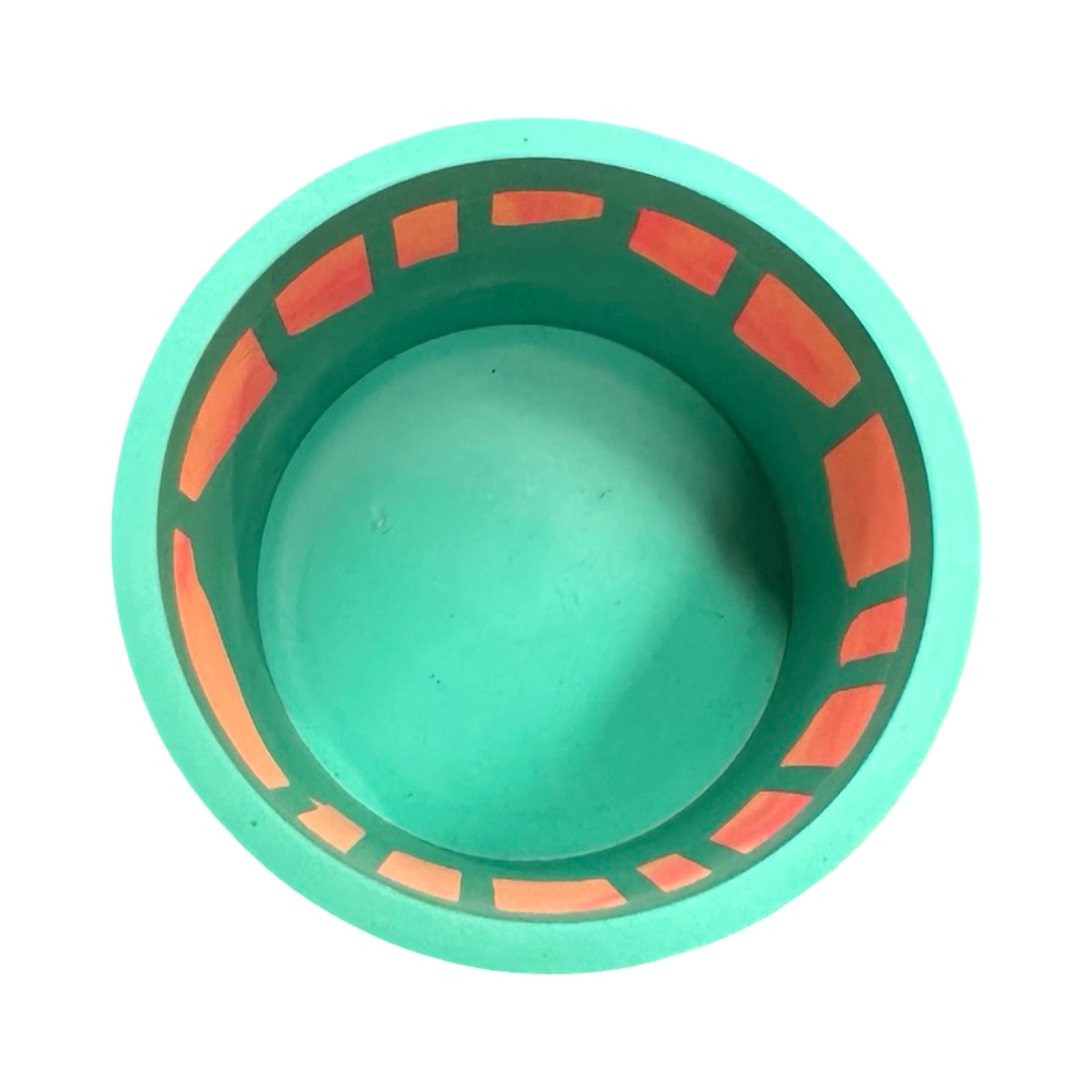 Green planter with orange decorative patterns on a white background.