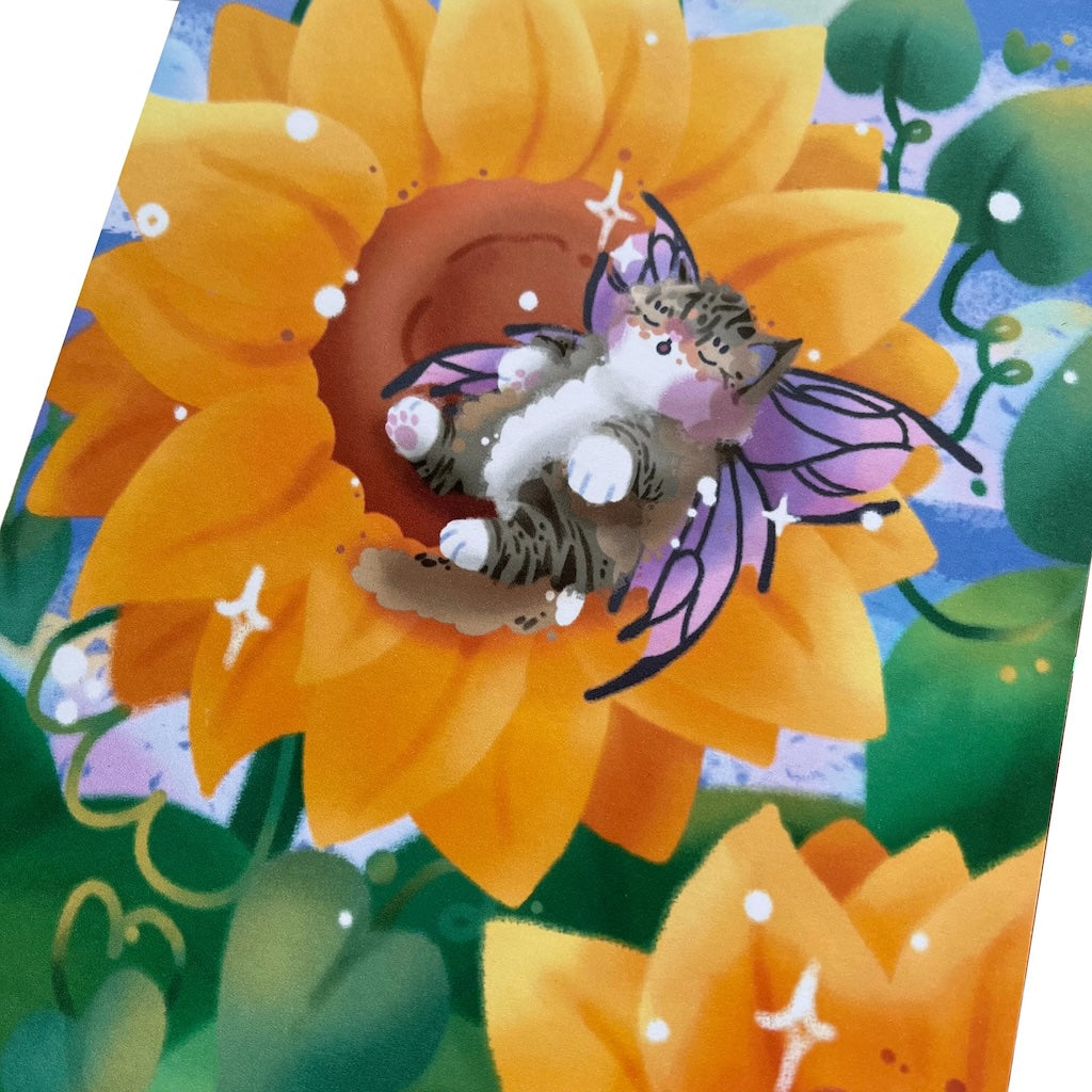 Art print of a grey, white, and ginger Norwegian Forest Cat with pink and black fairy wings, sleeping in a sunflower.