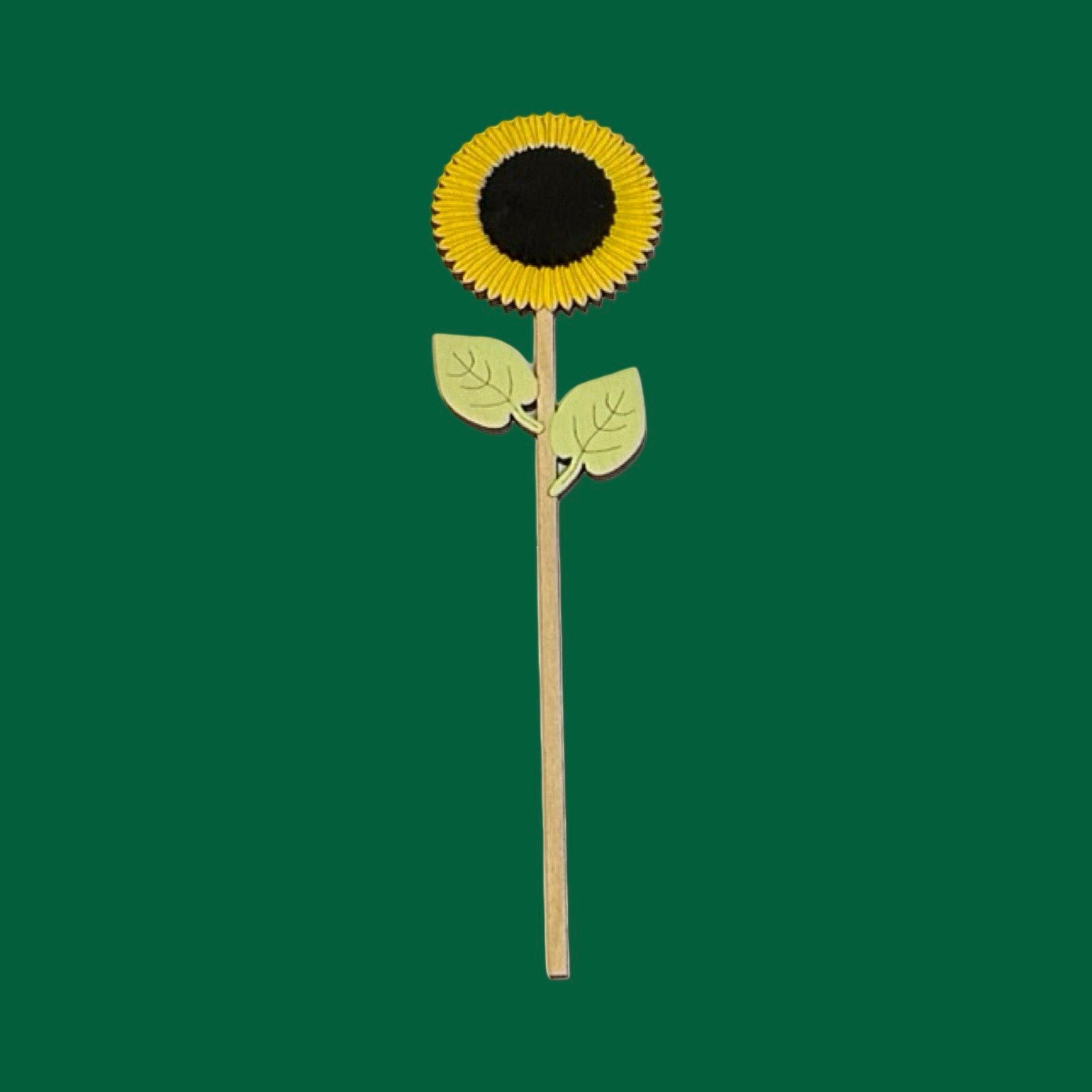 Sunflower wooden flower on a green background.
