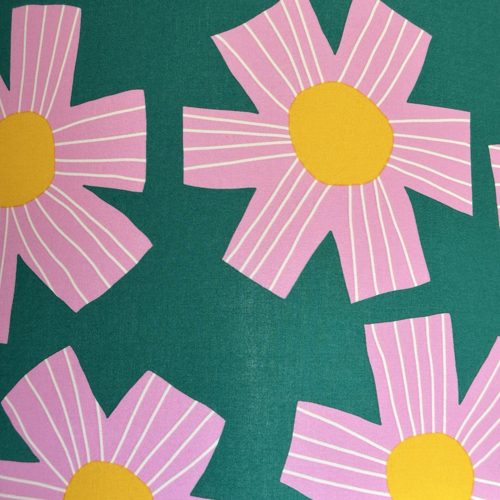 green cotton fabric with giant pink flowers