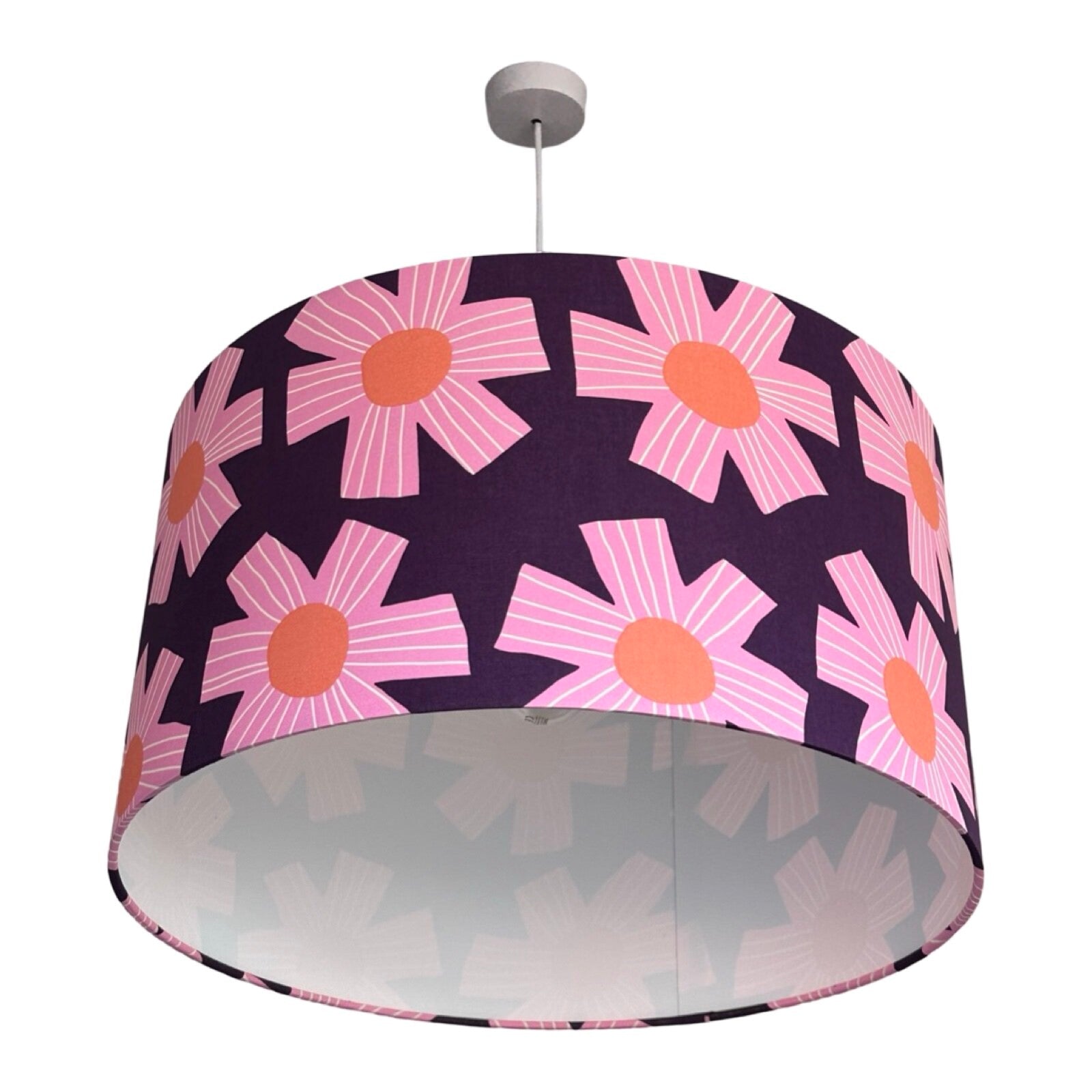 drum lampshade covered in purple cotton fabric with giant pink flowers