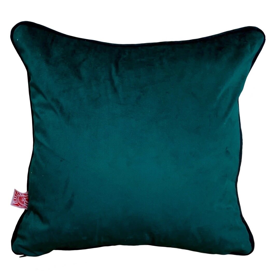 Deep turquoise velvet back of sunshine cushion.