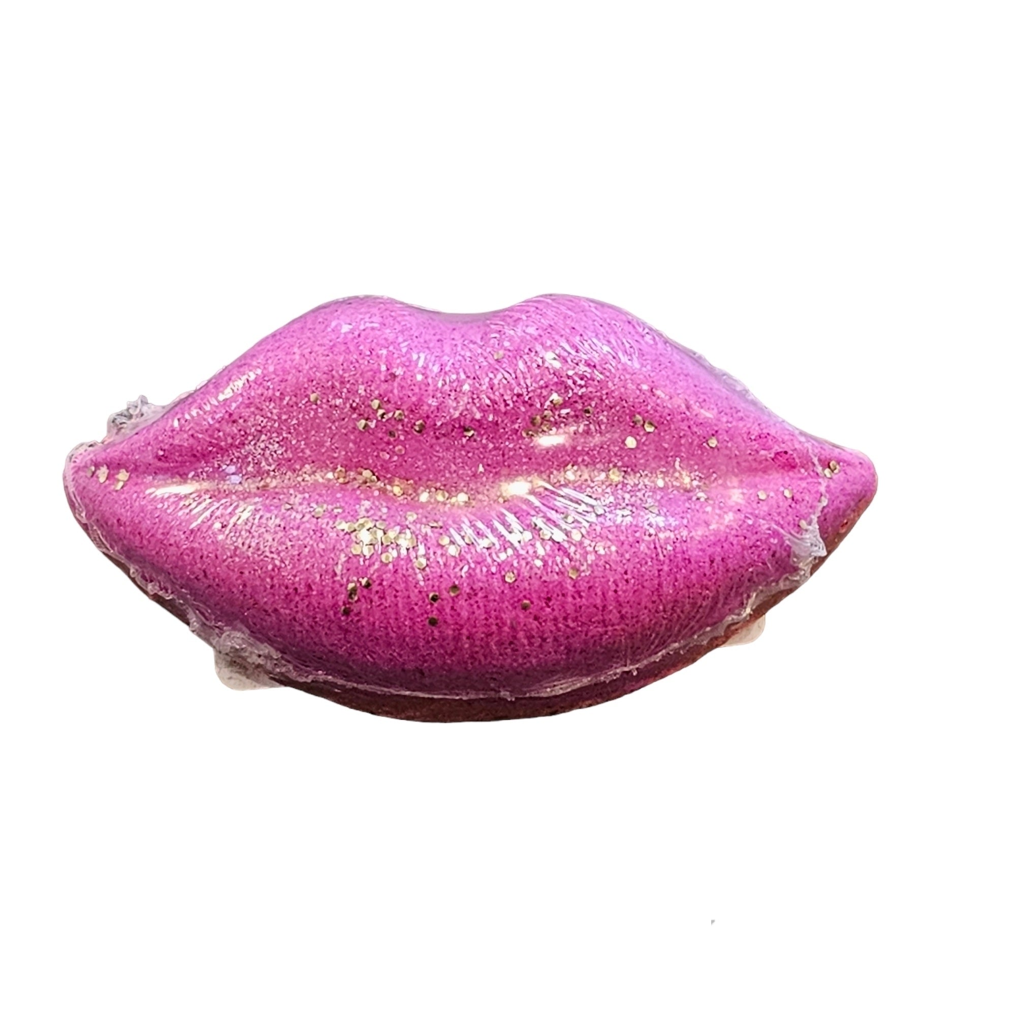A pink bath bomb int he shape of a pair of lips.